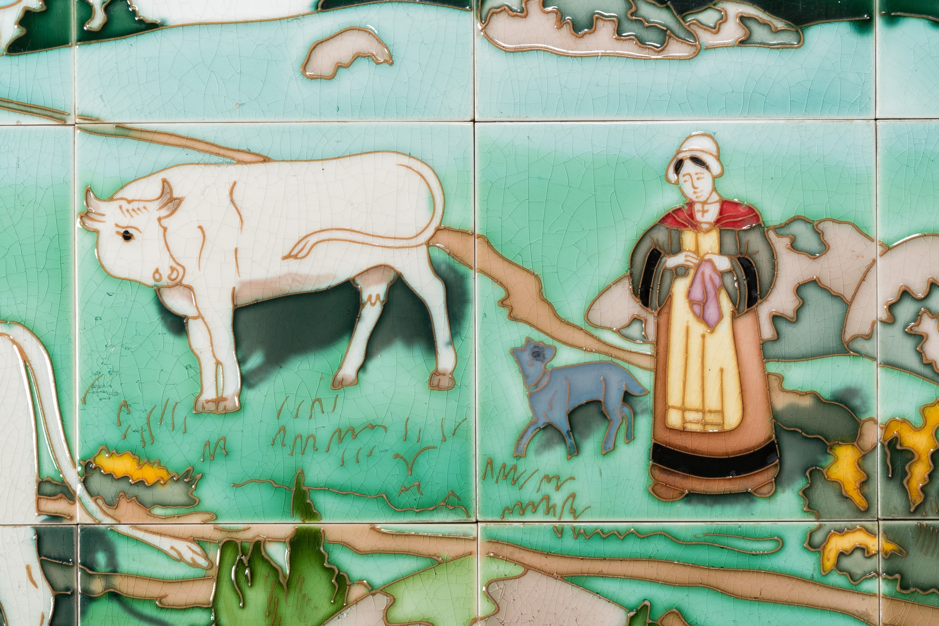 An Art Nouveau tile mural with a shepherdess and her cows in a meadow, Gilliot & Cie., Hemiksem - Image 2 of 4