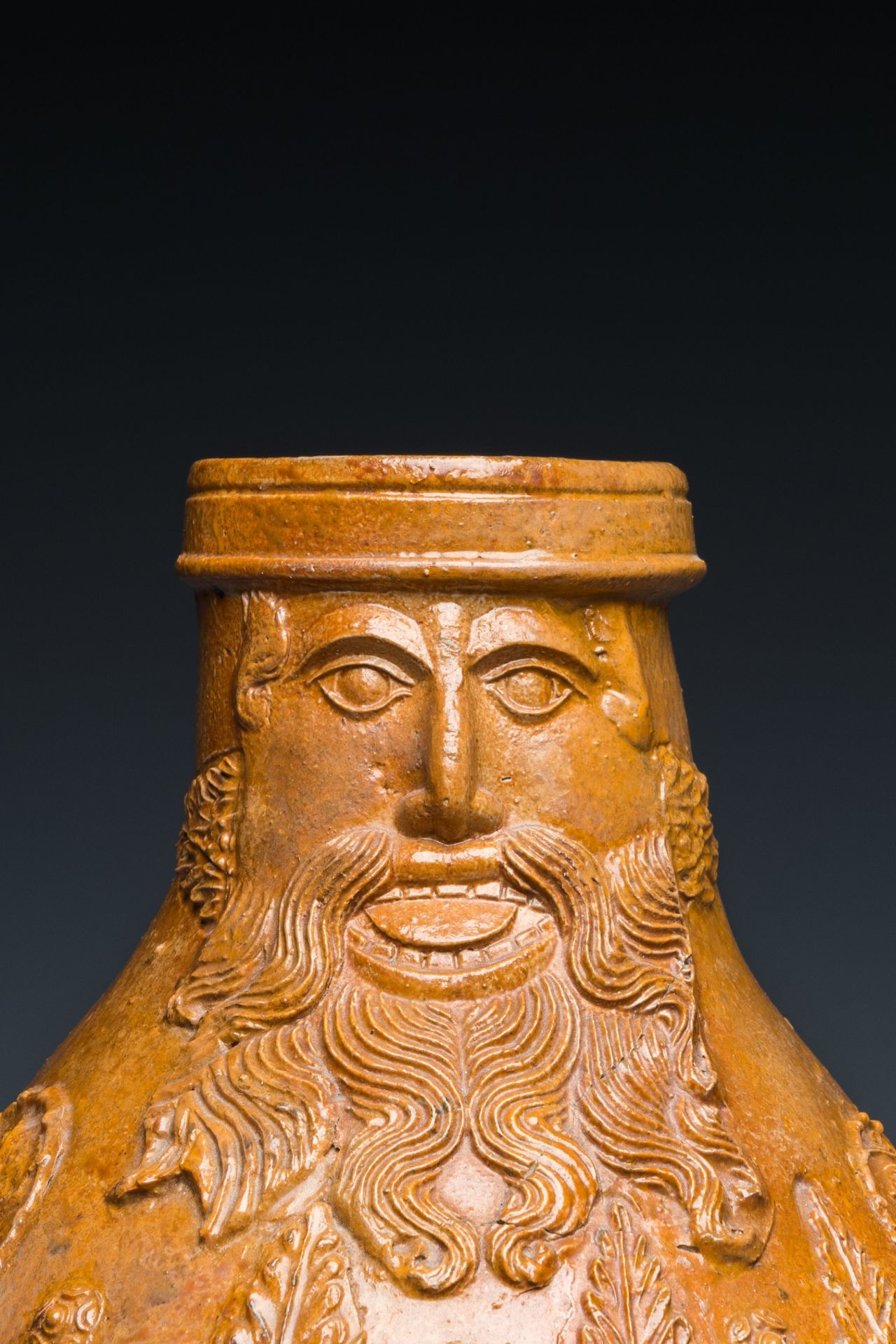 A rare German stoneware bellarmine jug with a bearded face sticking his tongue out, Cologne, 16th C. - Image 10 of 10