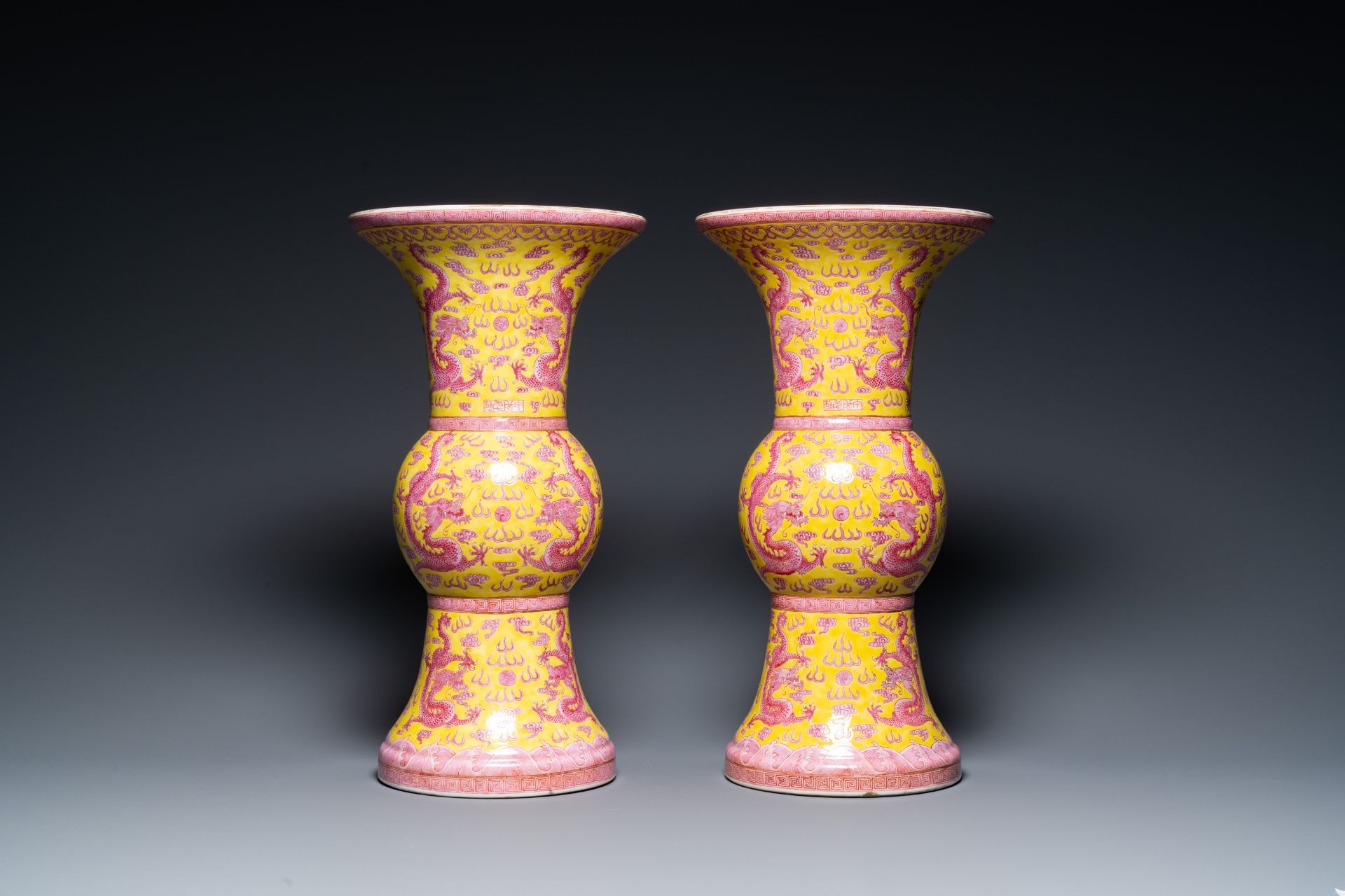 A pair of Chinese puce-enamelled yellow-ground 'gu' vases with dragons, Jia Xu Nian Zhi ____ mark, d