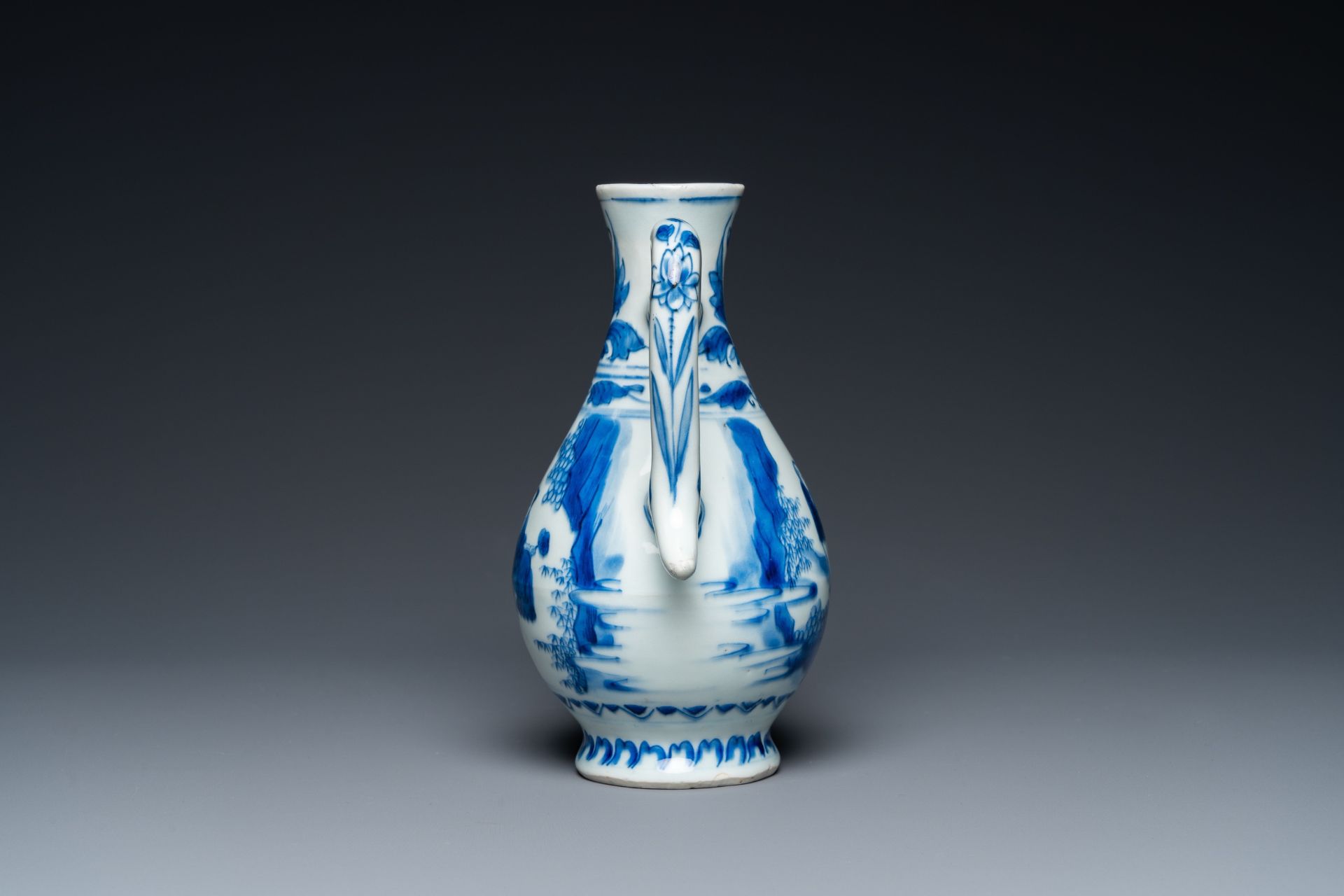 A Chinese blue and white ewer with figures in a landscape, Transitional period - Image 2 of 24