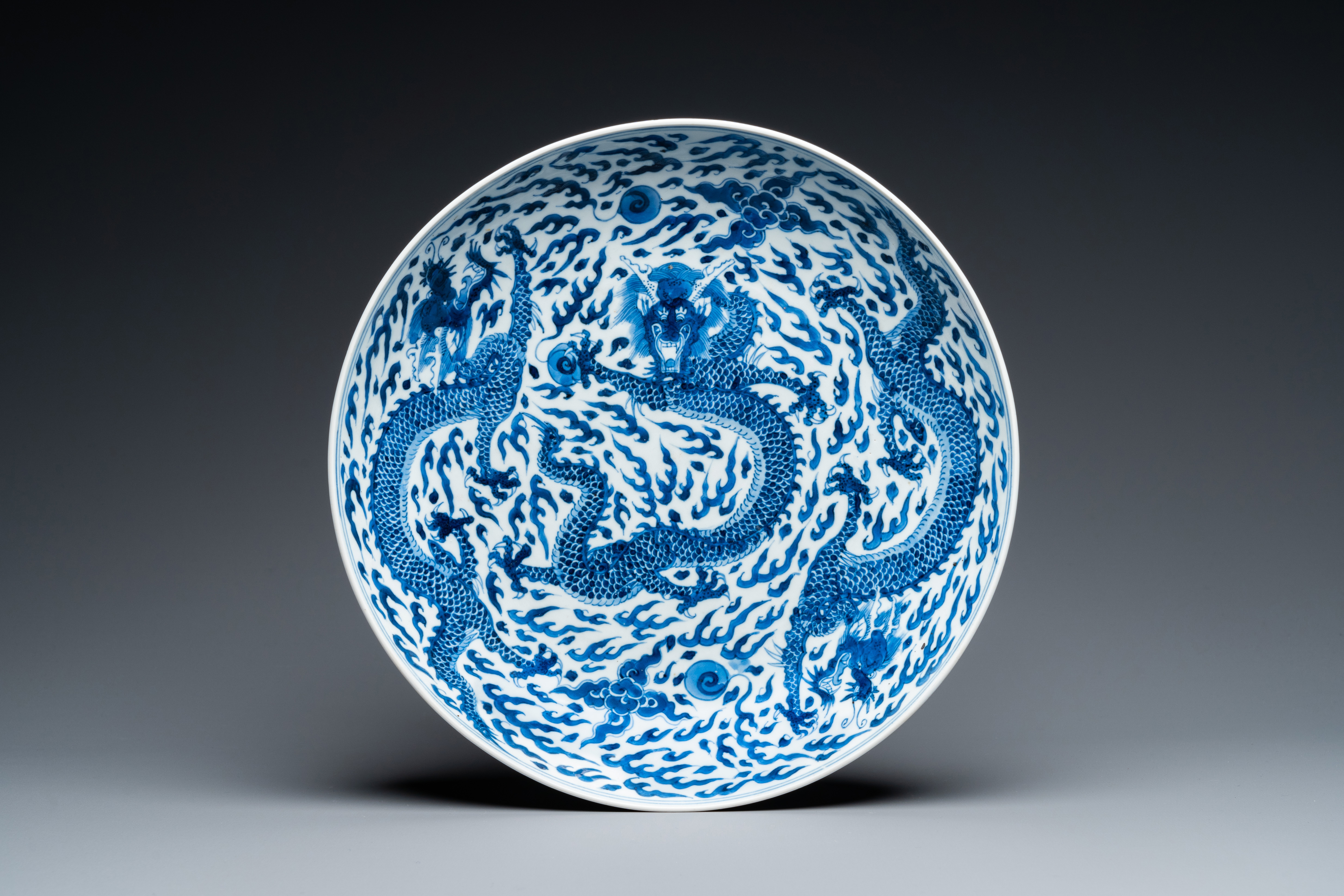 A Chinese blue and white 'dragon' dish, Kangxi mark and of the period