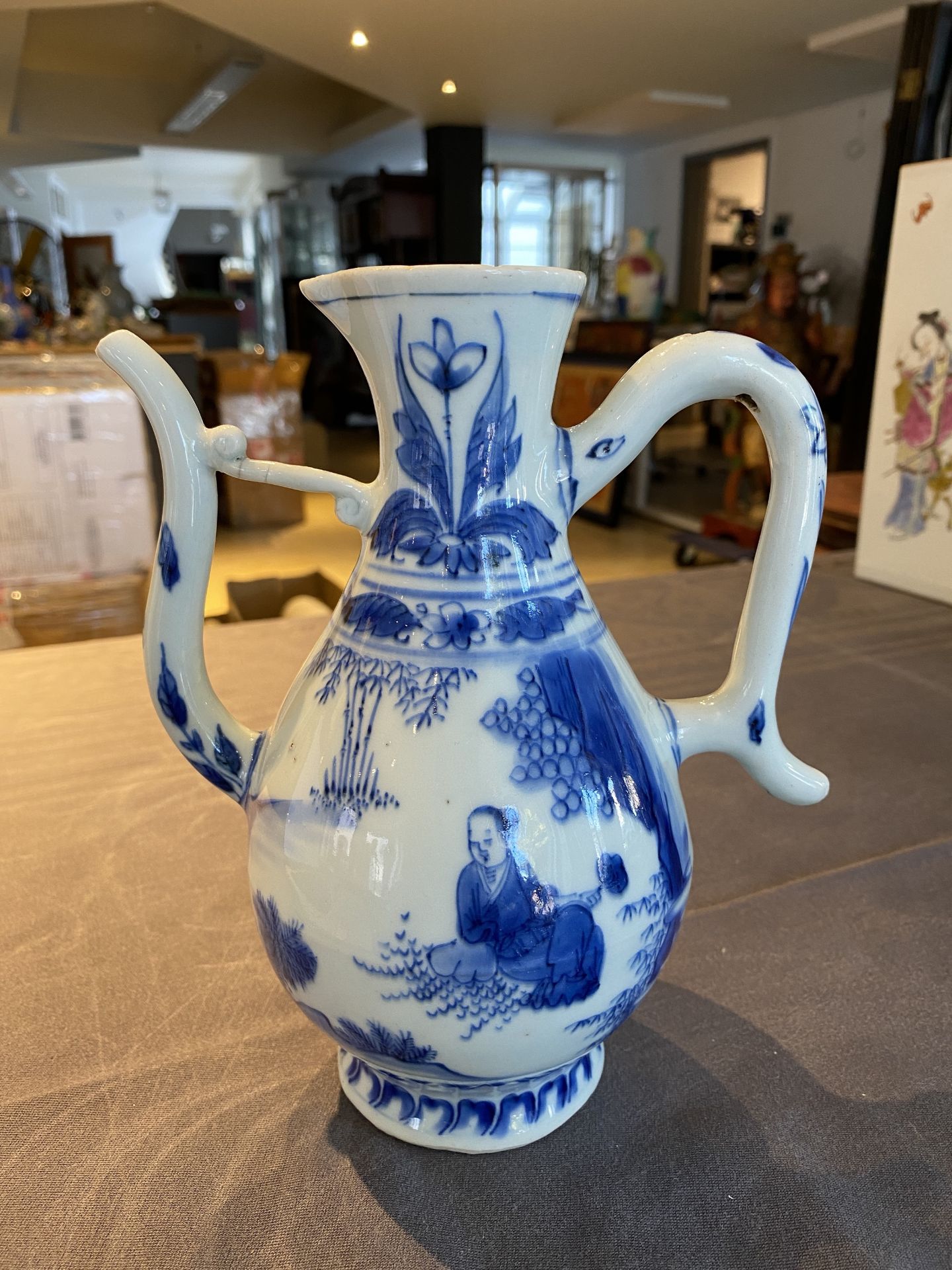 A Chinese blue and white ewer with figures in a landscape, Transitional period - Image 7 of 24