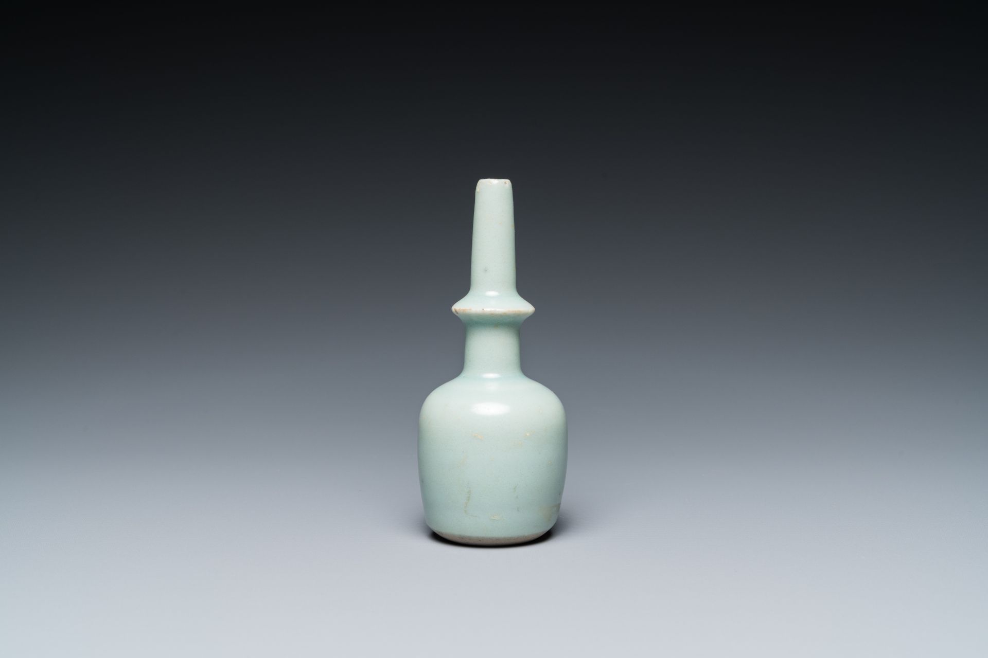 A Chinese celadon-glazed miniature 'kundika' vase, Song/Yuan