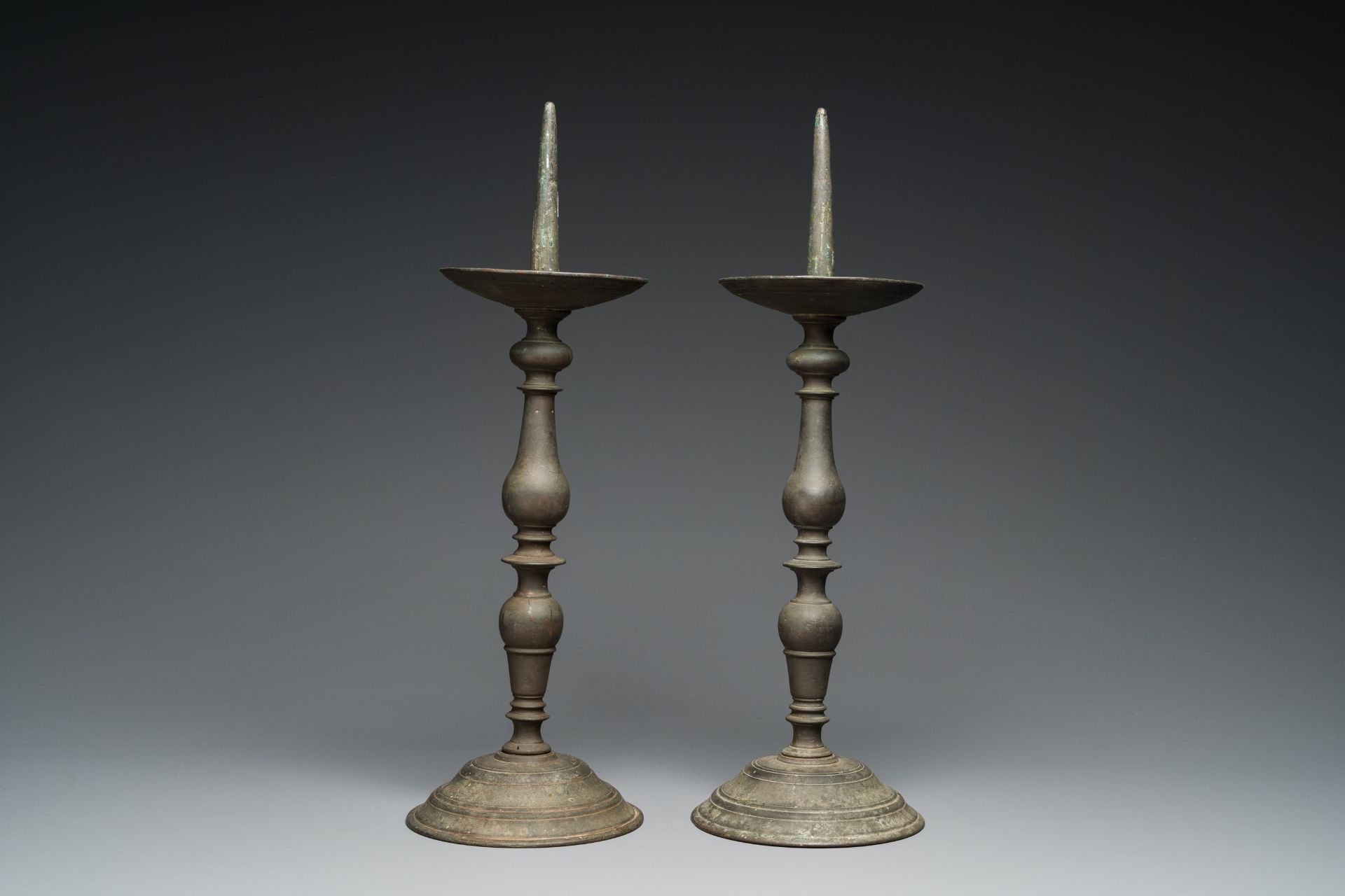 A pair of patinated bronze pricket candlesticks, France, 17th C. - Image 5 of 7