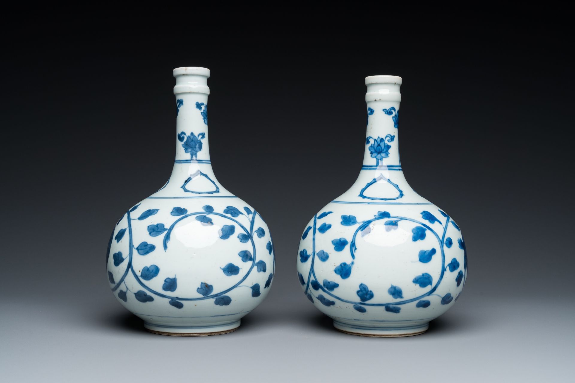 A pair of Chinese blue and white 'peony scroll' pharmacy bottles, Kangxi - Image 4 of 20