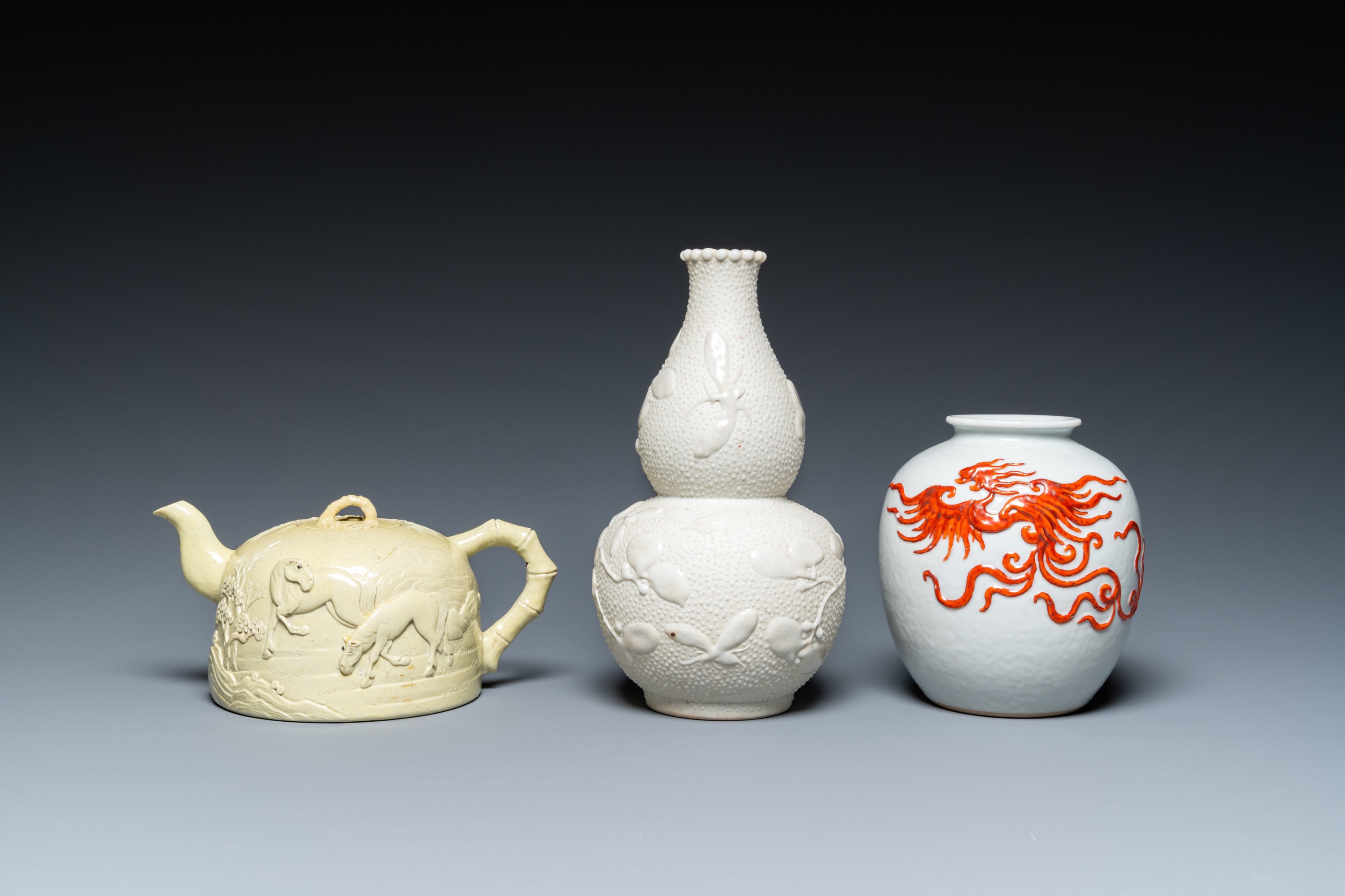 A Chinese yellow-glazed biscuit teapot, a white-glazed biscuit double gourd vase and an iron-red 'ph - Image 2 of 7