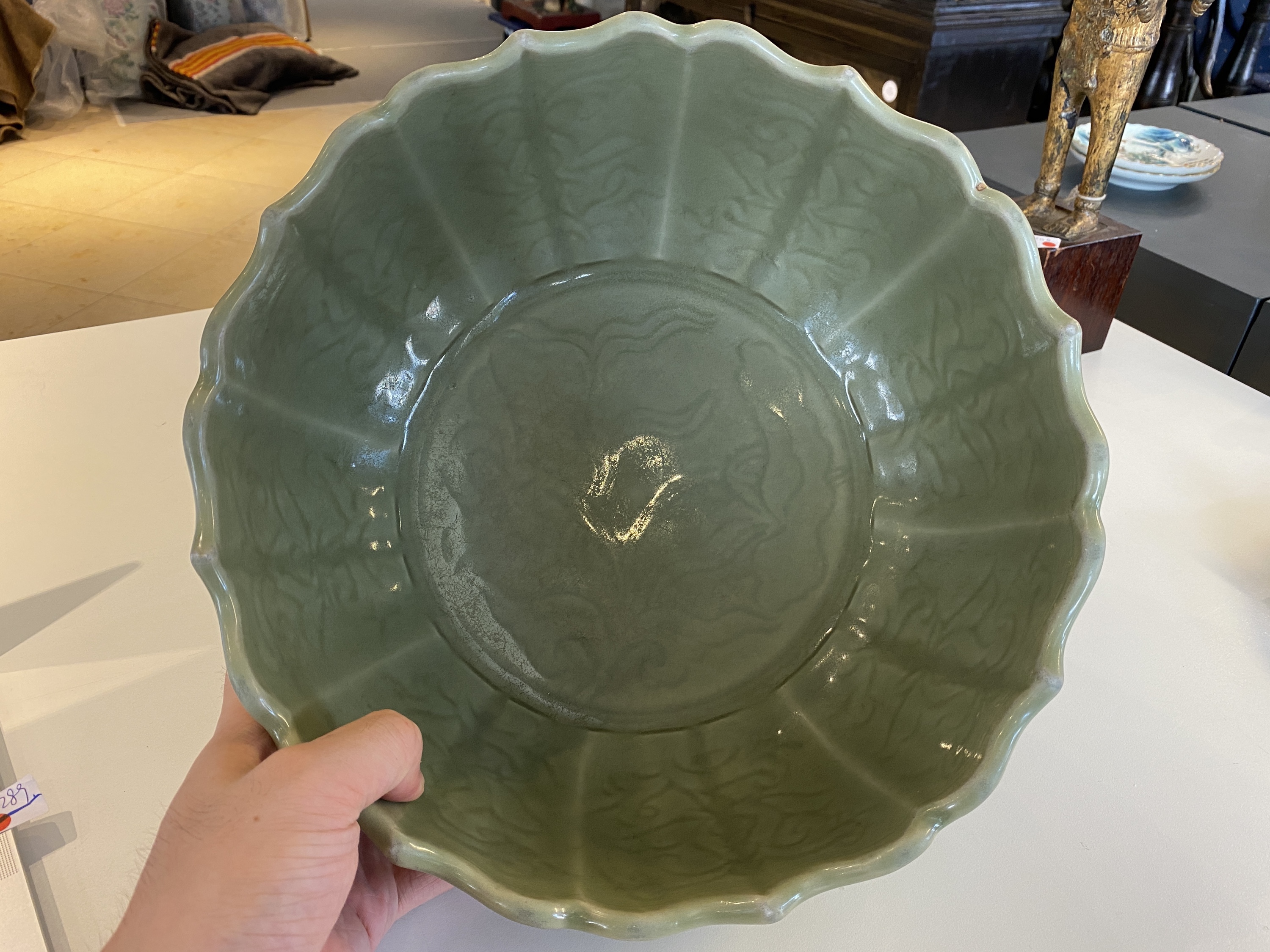 A large Chinese Longquan celadon bowl with underglaze lotus design, Ming - Image 9 of 17