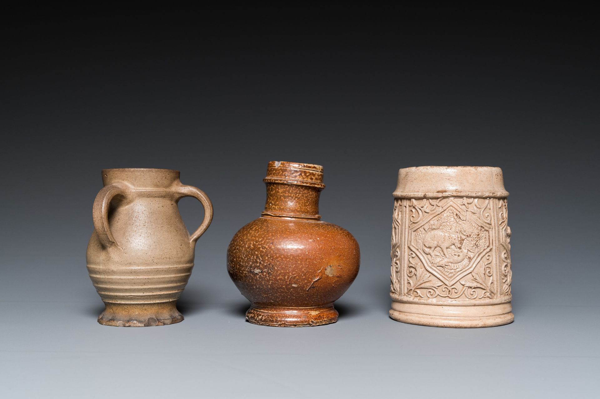 A German stoneware mug and two jugs, Raeren and Cologne, 16/17th C. - Image 3 of 7