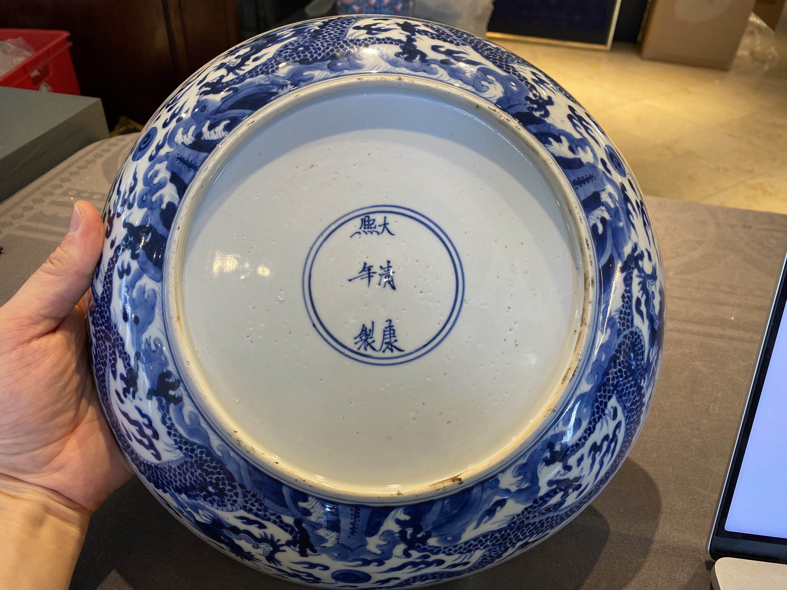 A Chinese blue and white 'dragon' dish, Kangxi mark and of the period - Image 8 of 18