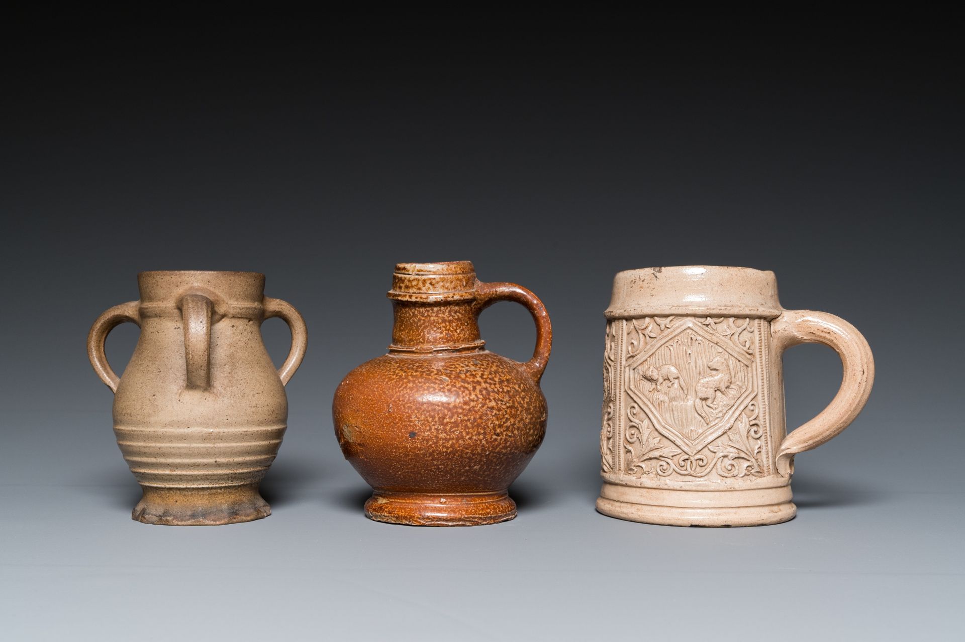 A German stoneware mug and two jugs, Raeren and Cologne, 16/17th C. - Image 2 of 7