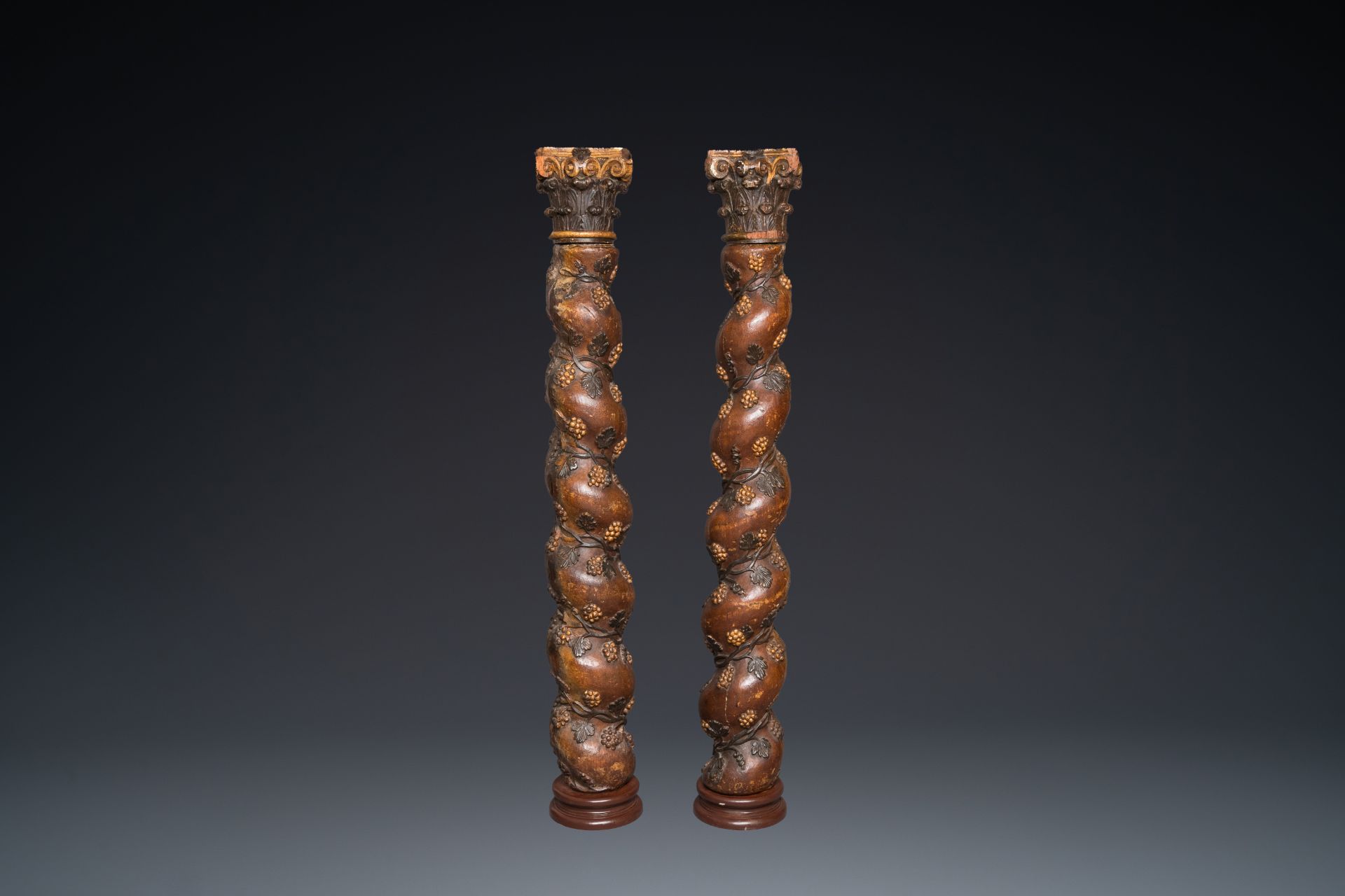A pair of patinated wooden 'grapevine' columns, 18th C.