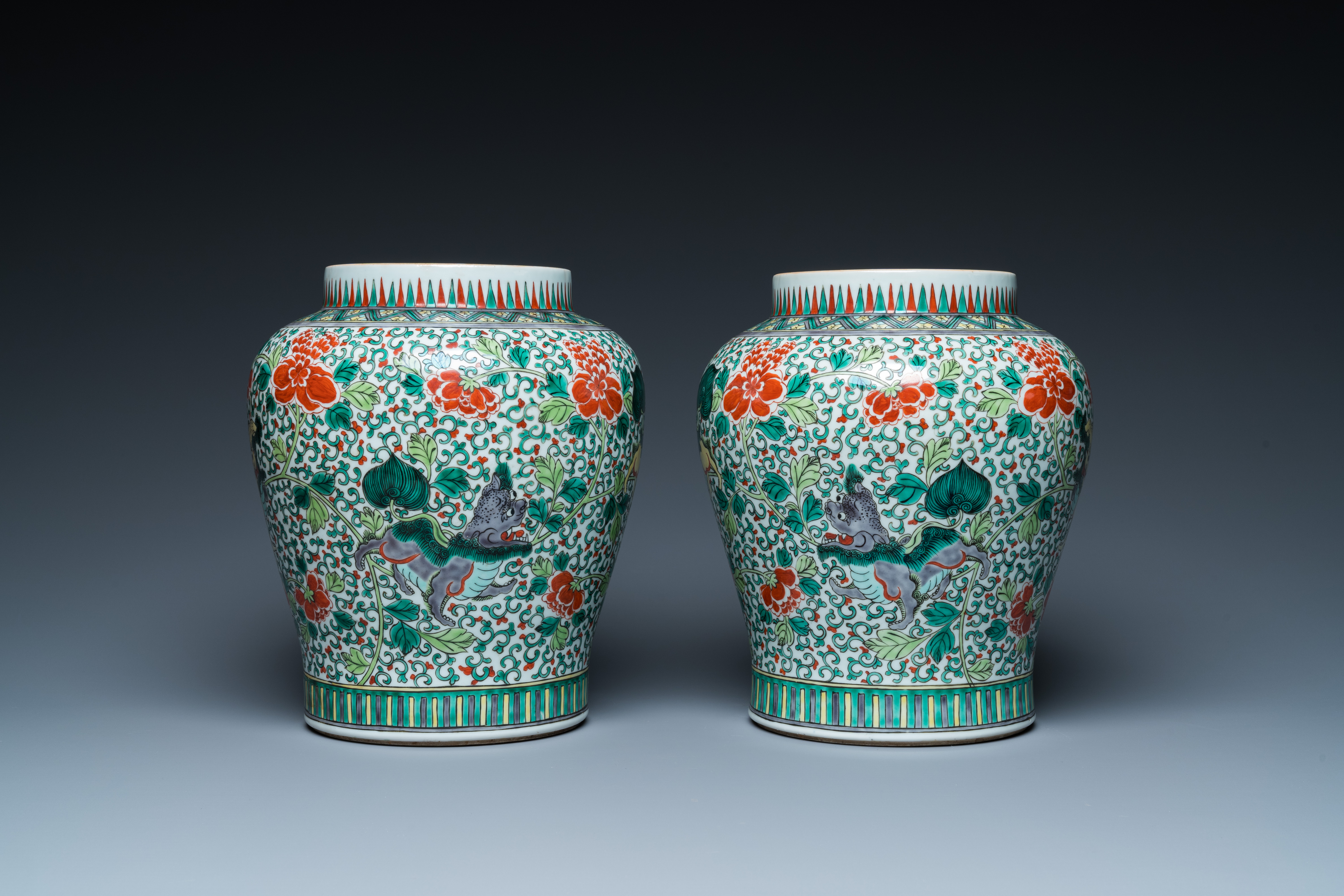 A pair of Chinese famille verte 'Buddhist lions' vases, 19th C.