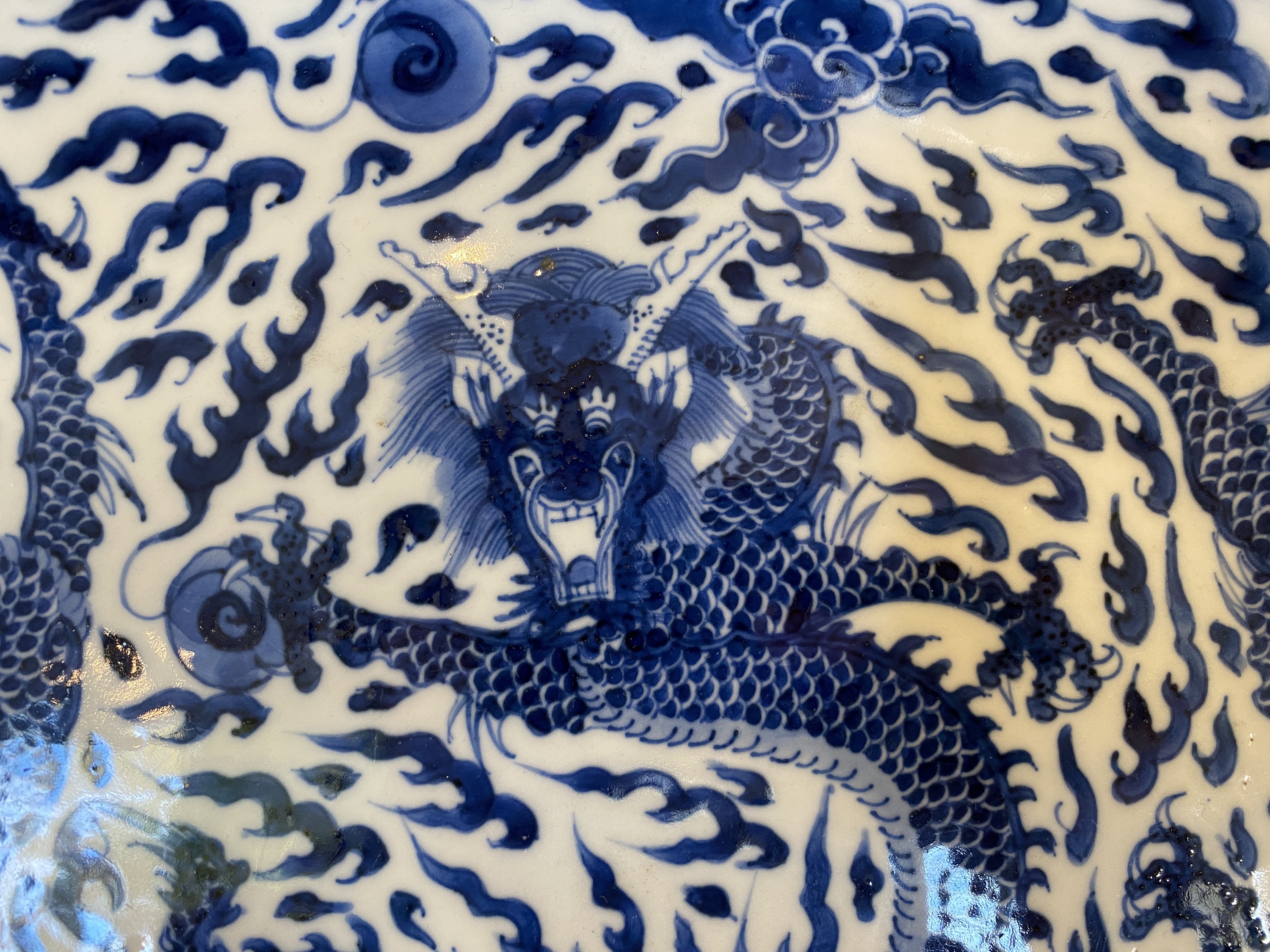 A Chinese blue and white 'dragon' dish, Kangxi mark and of the period - Image 4 of 18