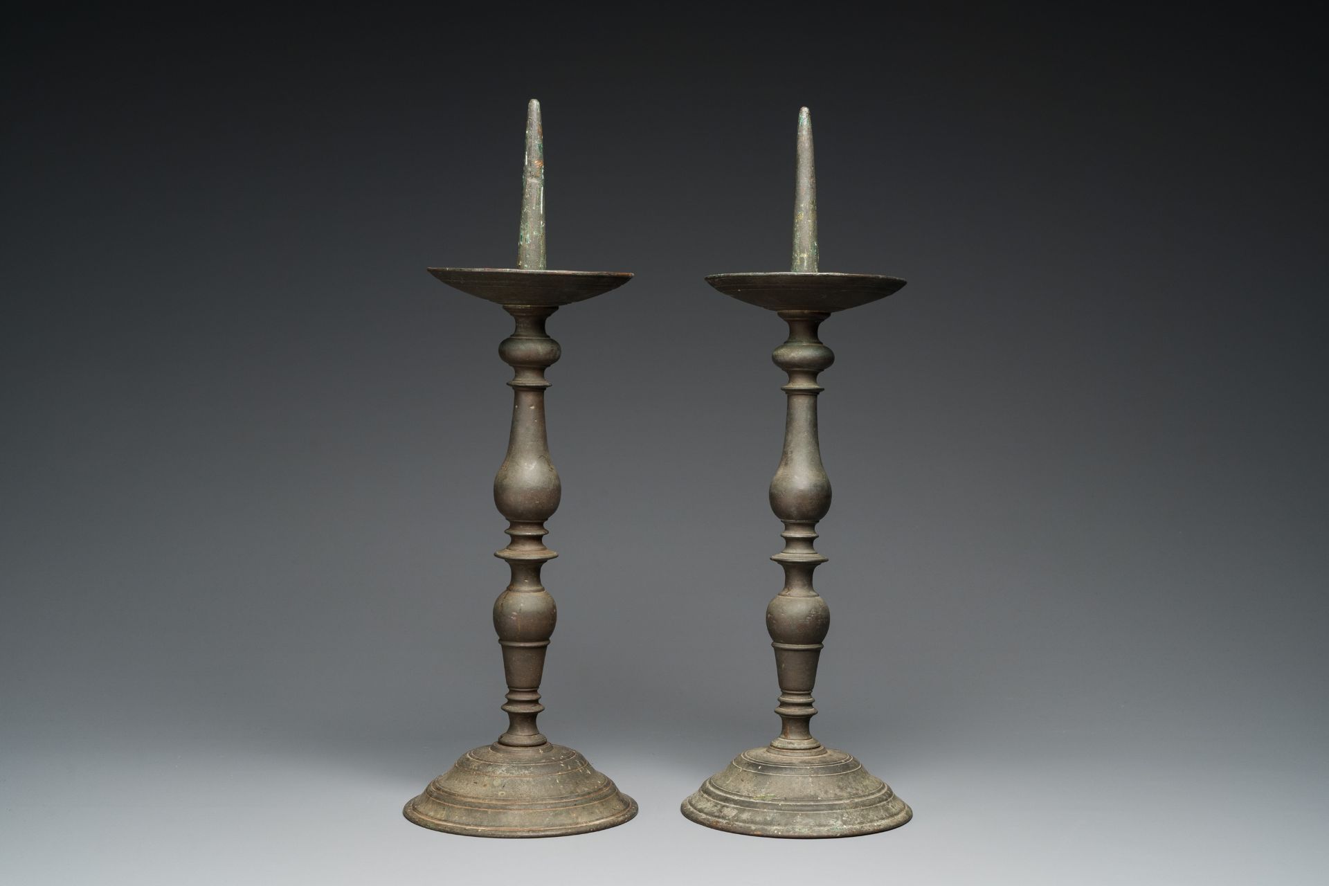 A pair of patinated bronze pricket candlesticks, France, 17th C. - Image 2 of 7