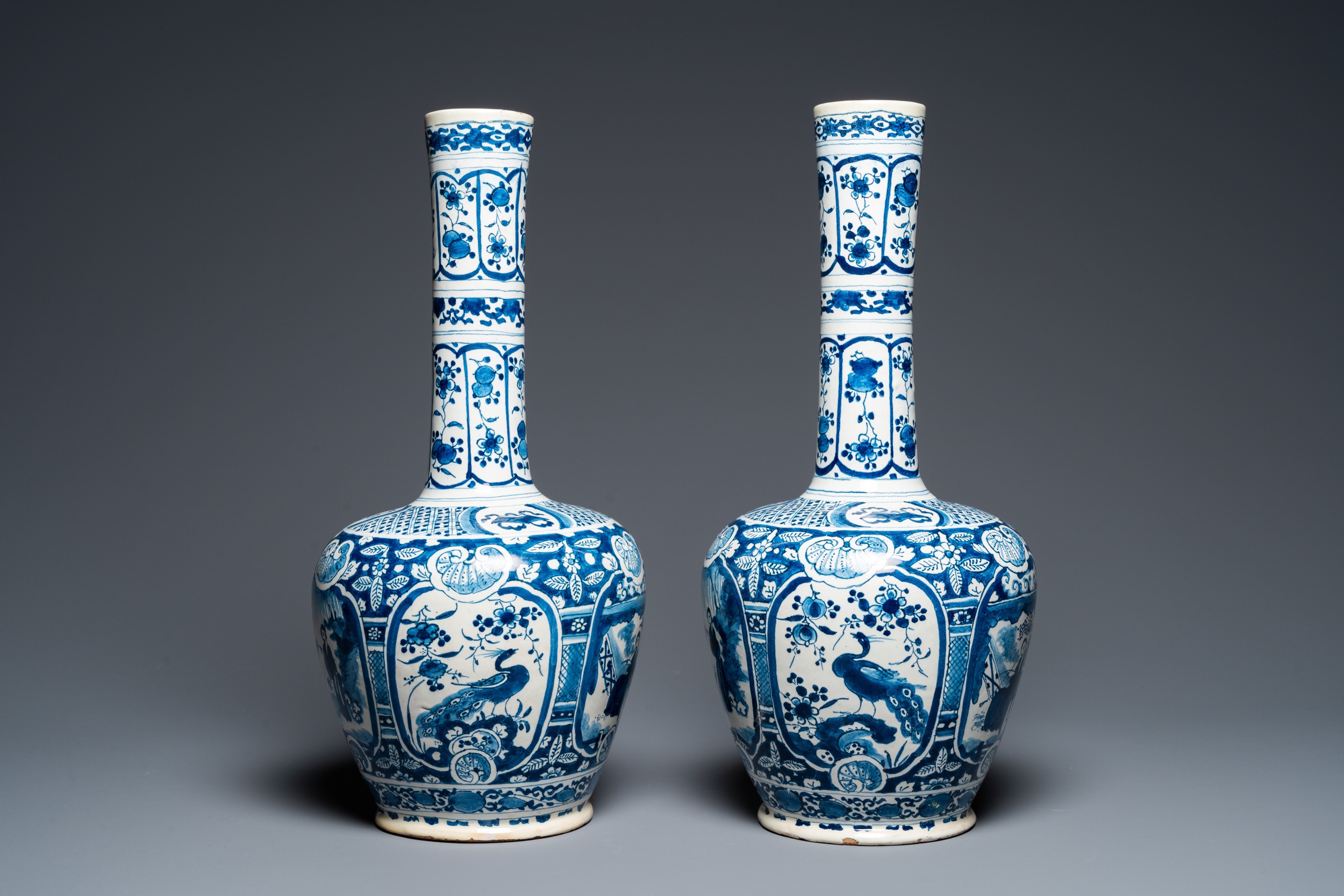 A pair of Dutch Delft blue and white chinoiserie bottle vases, 18th C. - Image 4 of 33