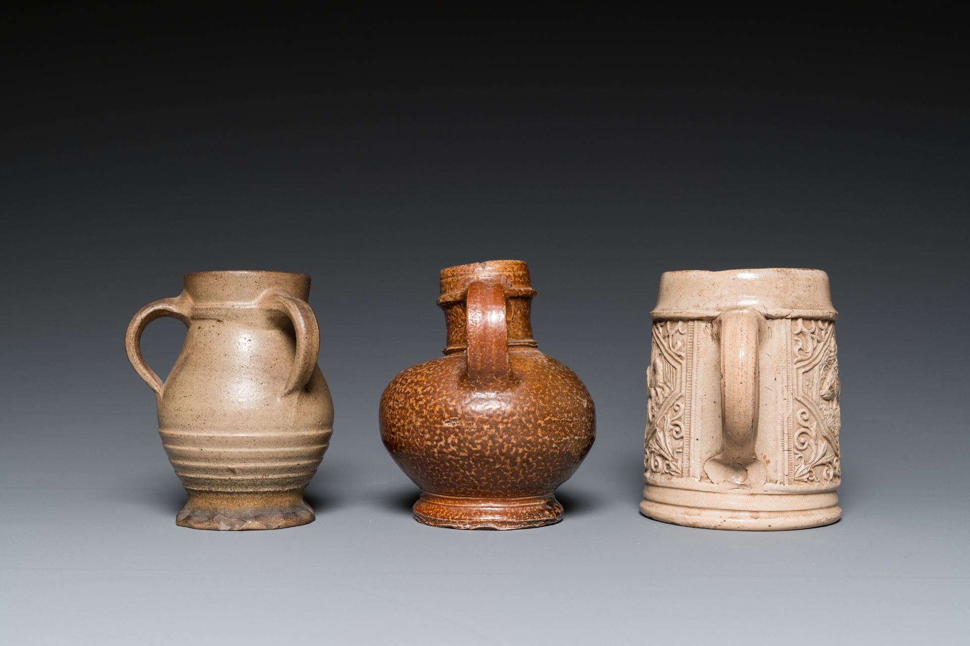 A German stoneware mug and two jugs, Raeren and Cologne, 16/17th C. - Image 5 of 7