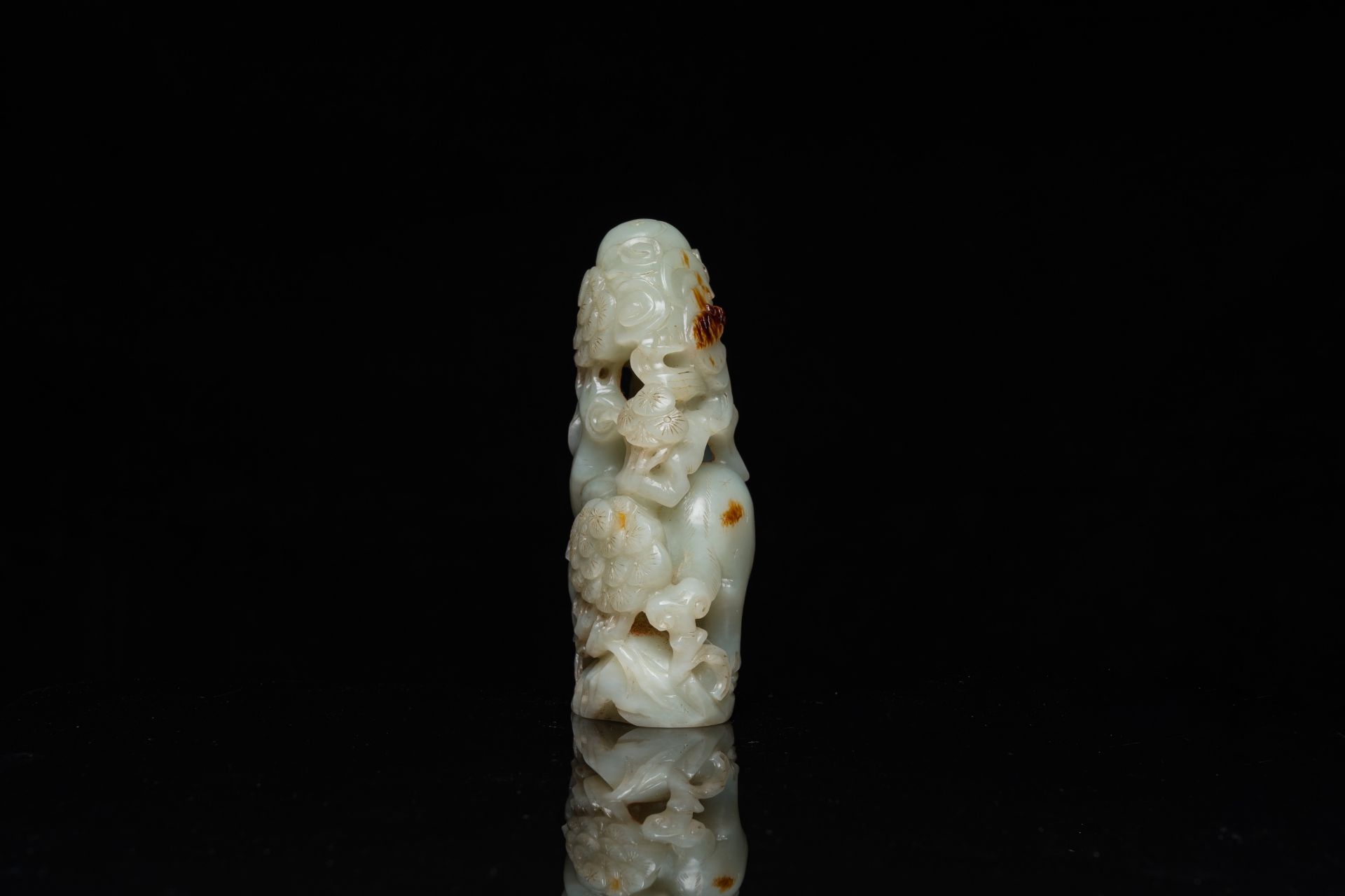 A Chinese celadon and russet jade ram sculpture on wooden stand, 19th C. - Image 5 of 18