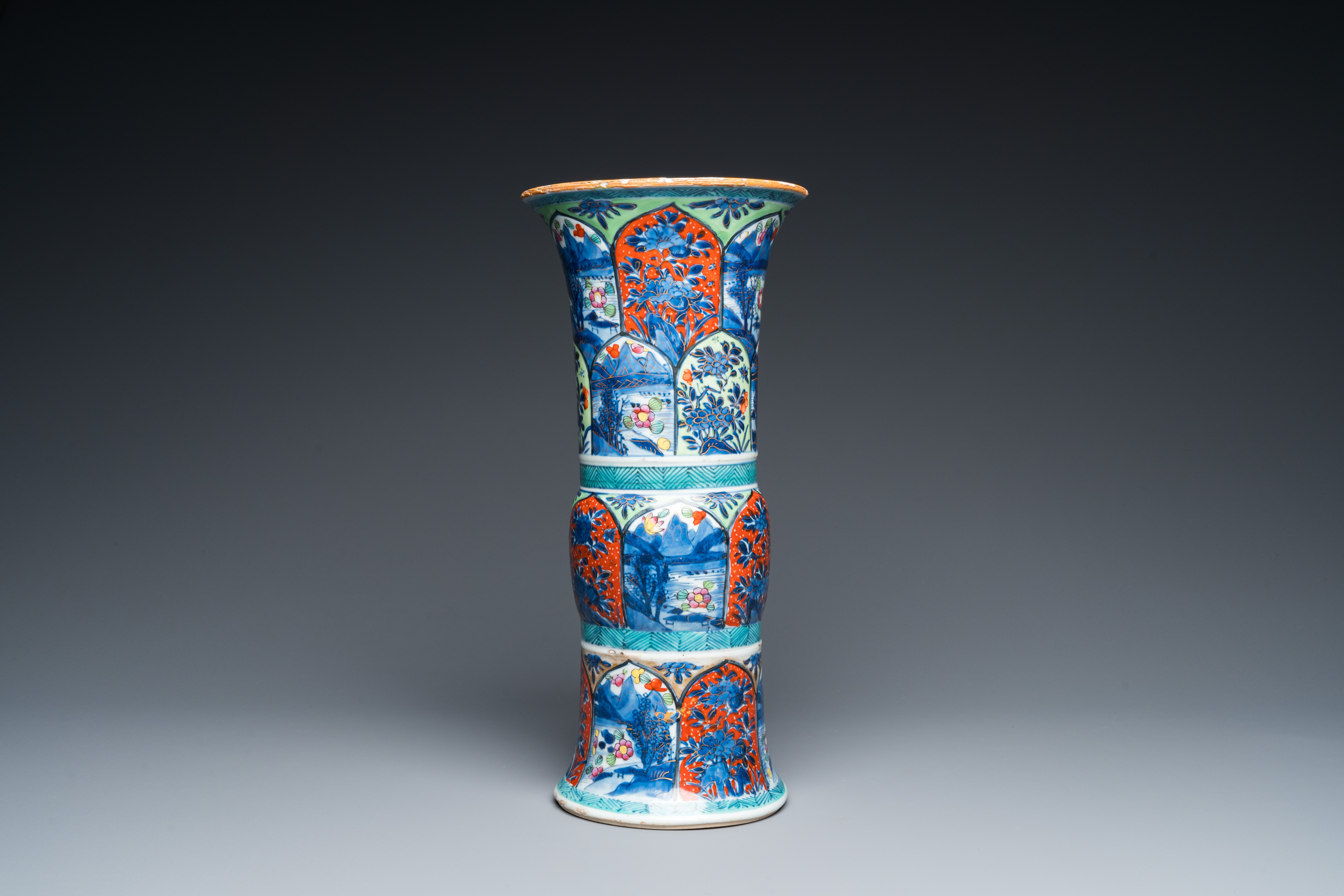 A Chinese blue and white 'gu' vase with European clobbered design, Kangxi