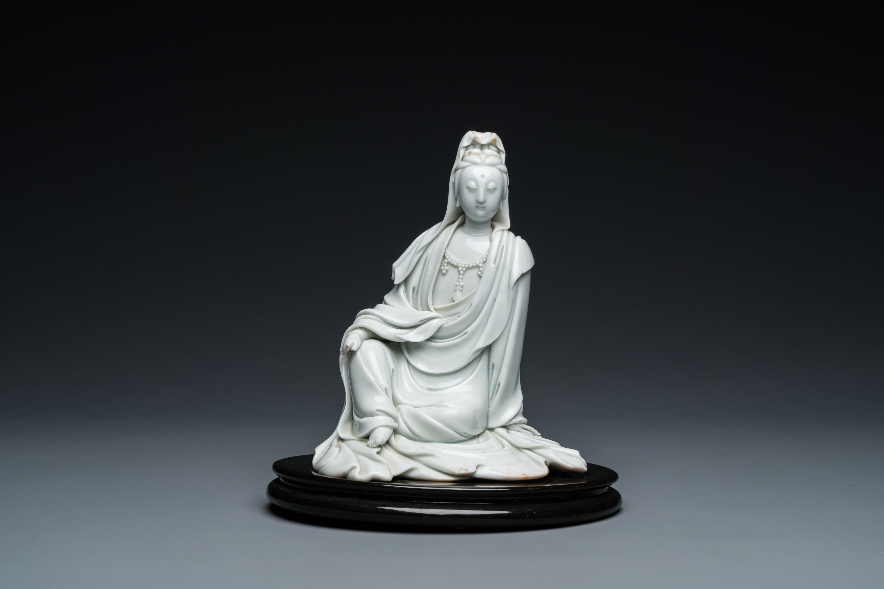 A Chinese Dehua blanc de Chine figure of Guanyin, He Zhang Yong Yin ____ mark, Kangxi