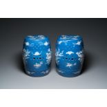 A pair of Chinese white slip-decorated blue-ground garden seats, 19th C.