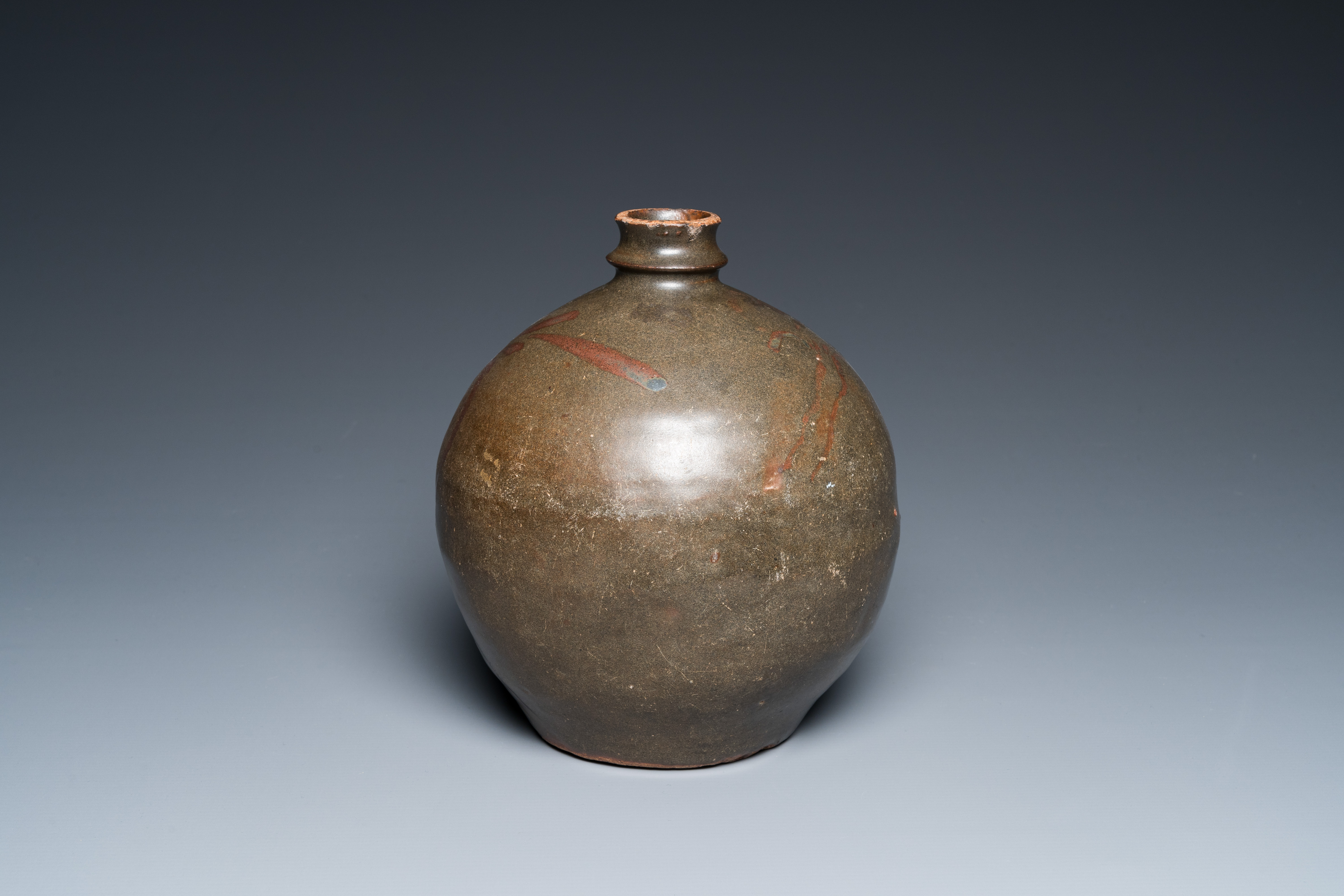 A Chinese brown-glazed globular vase with floral design, Song