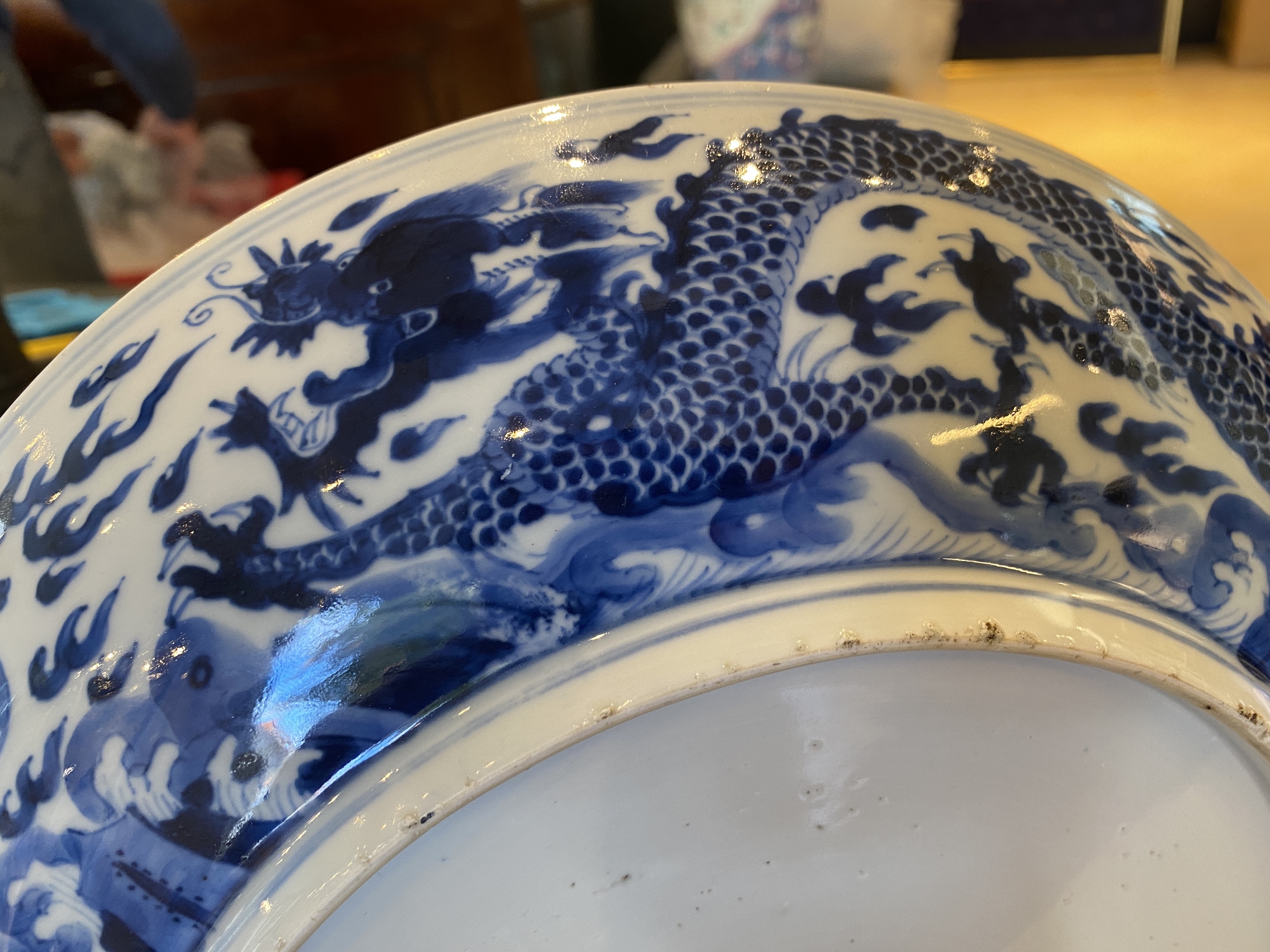 A Chinese blue and white 'dragon' dish, Kangxi mark and of the period - Image 12 of 18
