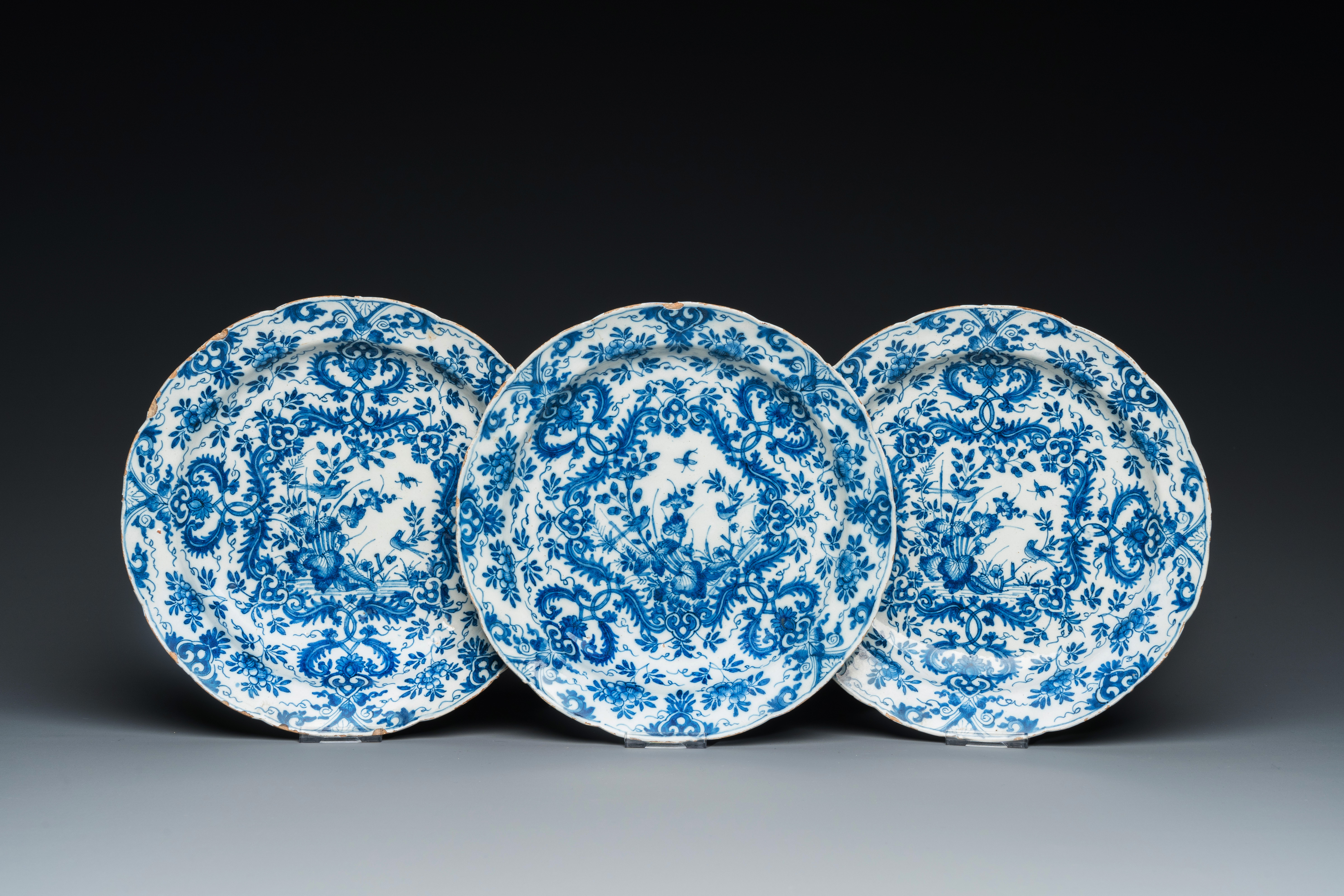 Three Dutch Delft blue and white plates with floral design, 1st quarter 18th C.