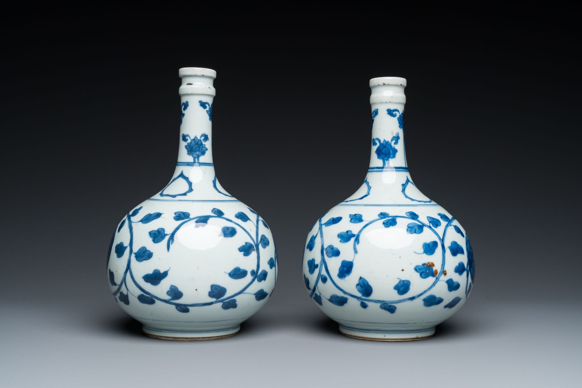 A pair of Chinese blue and white 'peony scroll' pharmacy bottles, Kangxi - Image 2 of 20