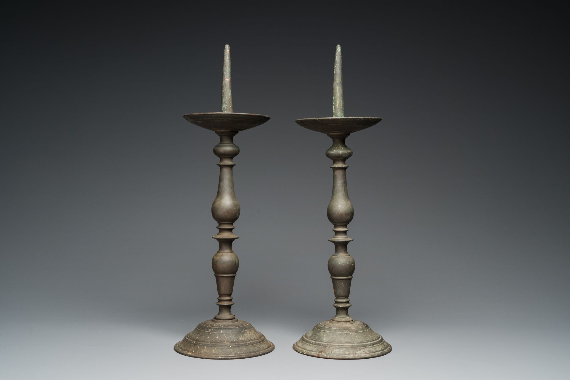 A pair of patinated bronze pricket candlesticks, France, 17th C. - Image 4 of 7