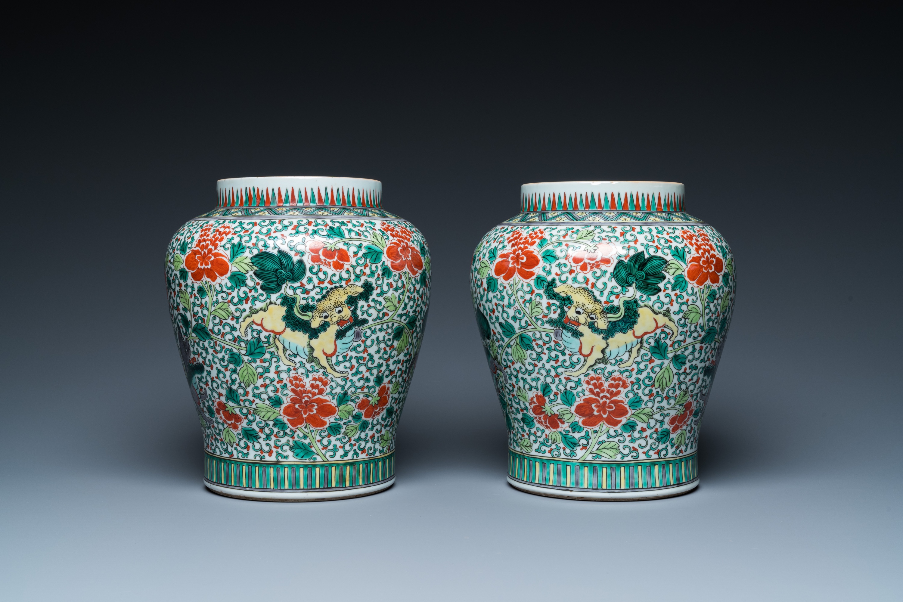 A pair of Chinese famille verte 'Buddhist lions' vases, 19th C. - Image 4 of 16