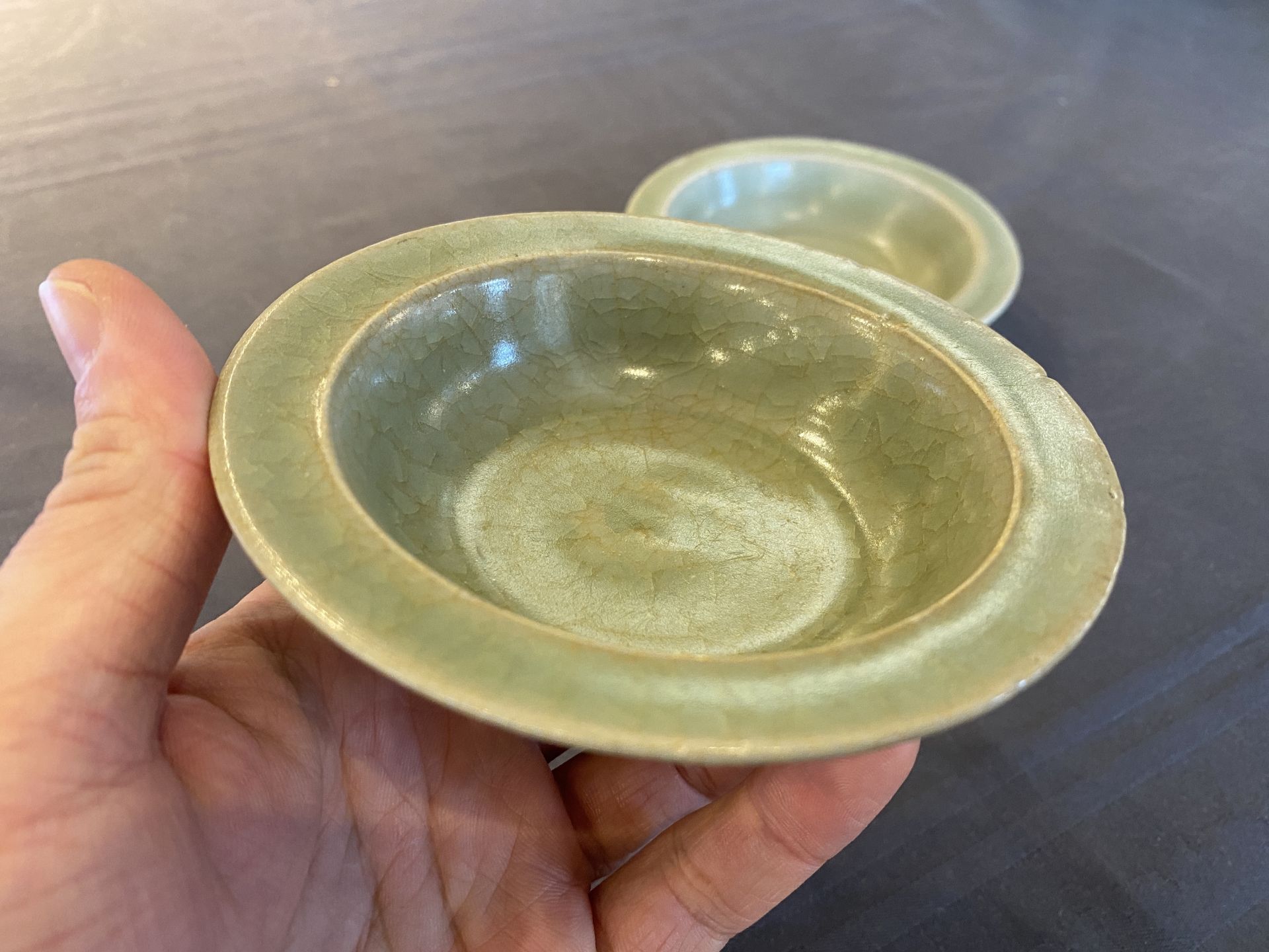 Two Chinese celadon-glazed bowls, one with twin fish, Ming - Image 6 of 14