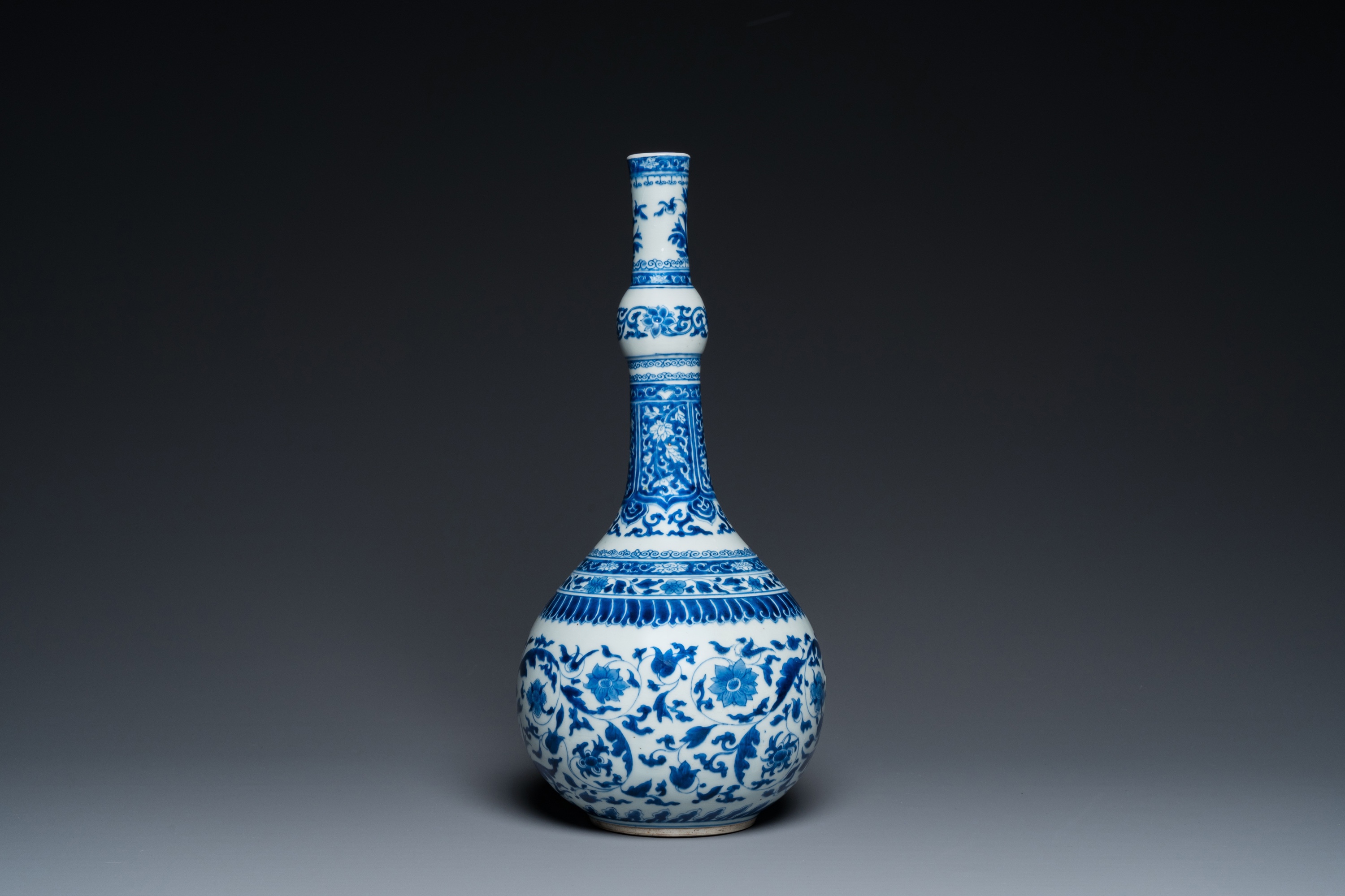 A Chinese blue and white bottle vase with floral design, Kangxi - Image 3 of 23