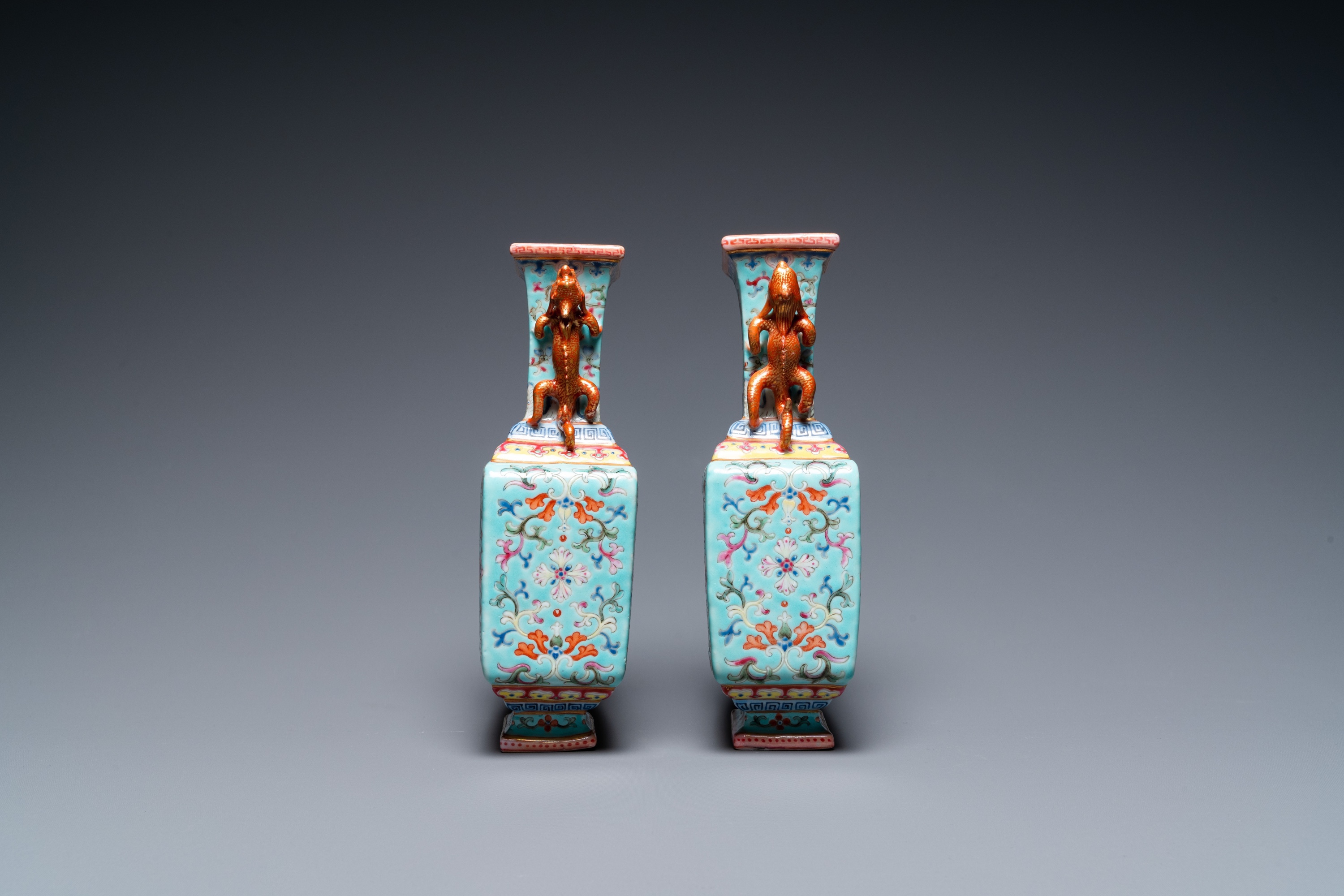 A pair of Chinese famille rose turquoise-ground vases, Qianlong mark, 19/20th C. - Image 2 of 6