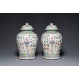 A pair of Chinese famille rose 'antiquities' vases and covers, 19th C.