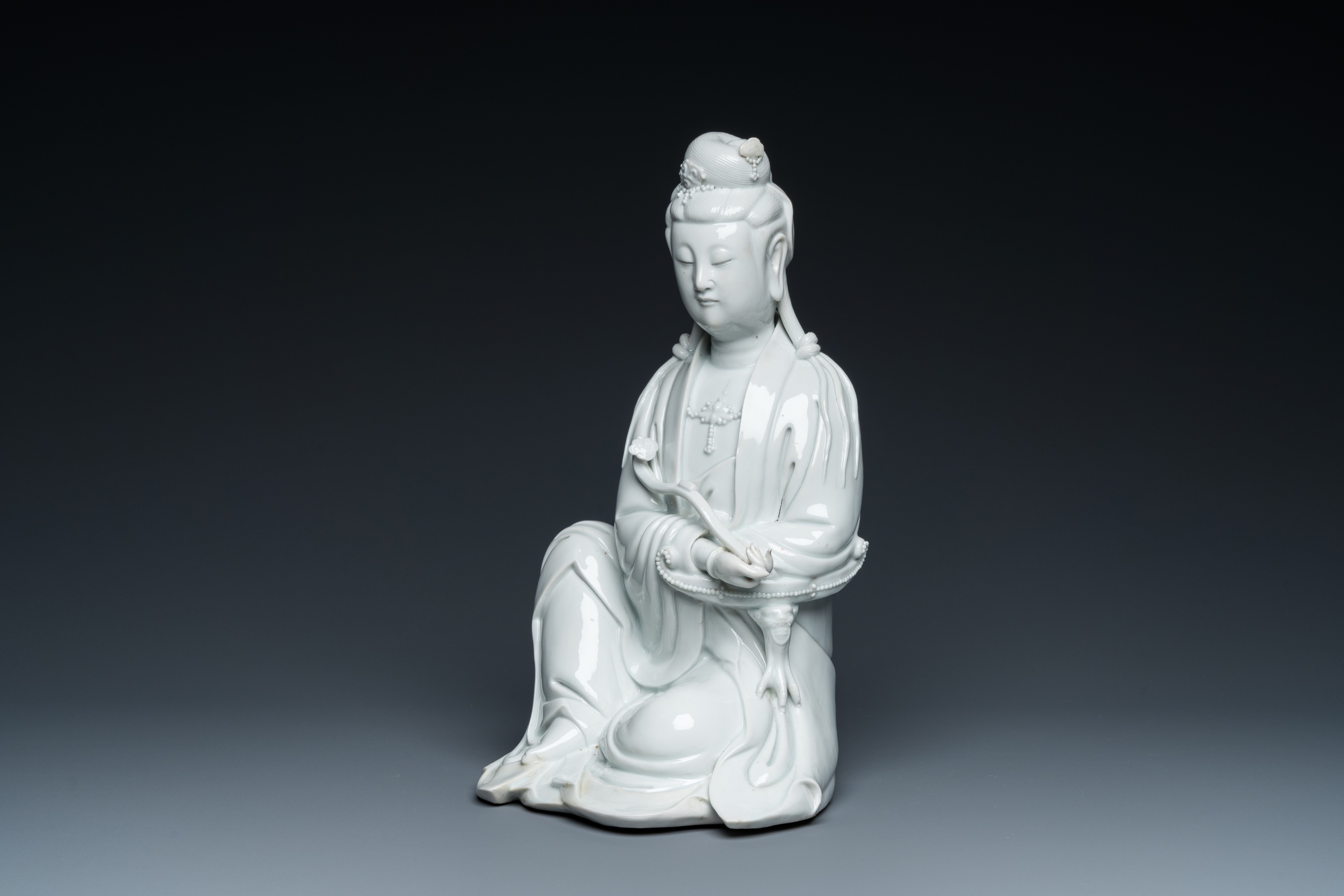A Chinese Dehua blanc de Chine sculpture of Guanyin with a ruyi, Boji Yuren ____ mark, 19/20th C.