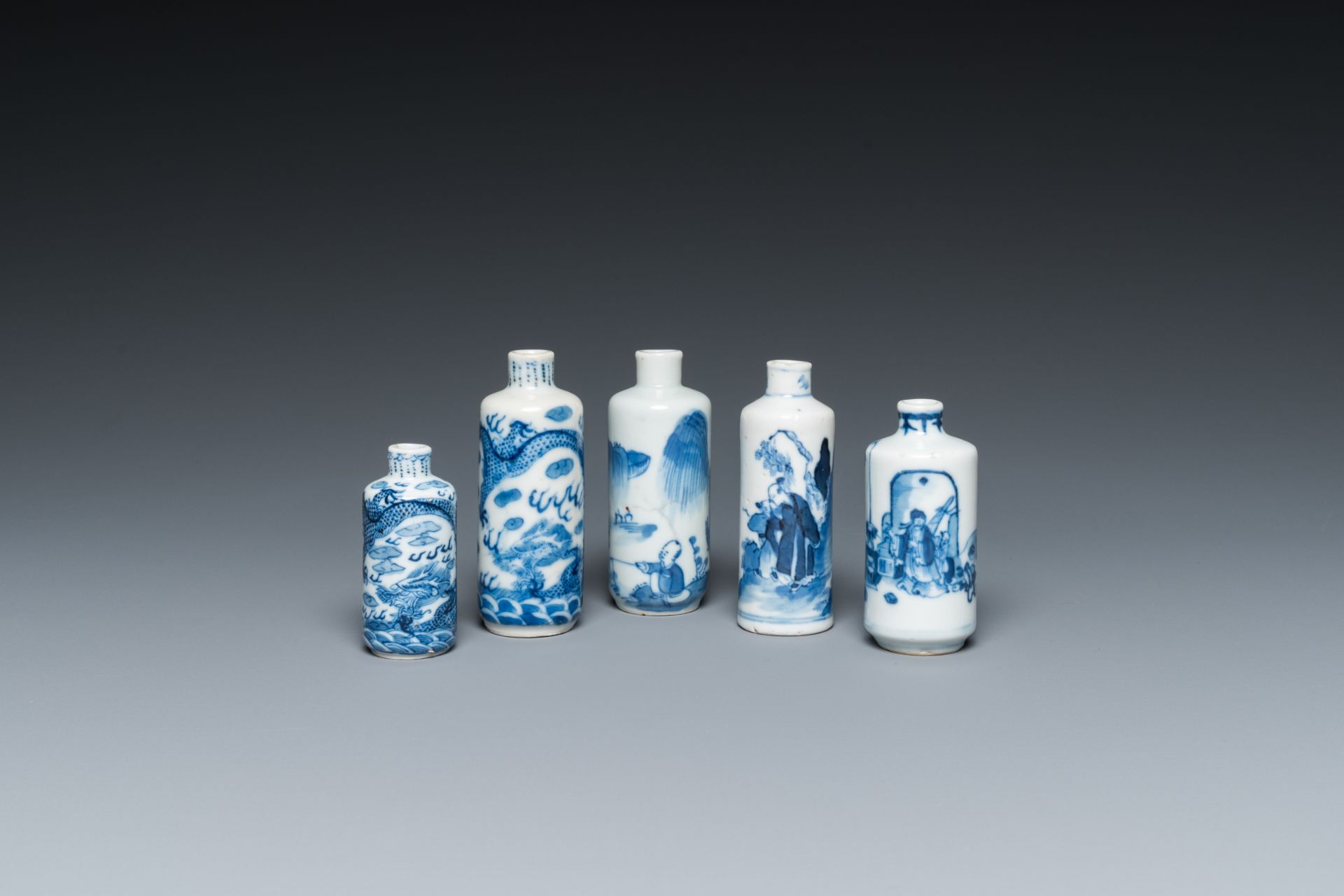 Five Chinese blue and white snuff bottles, 19th C.