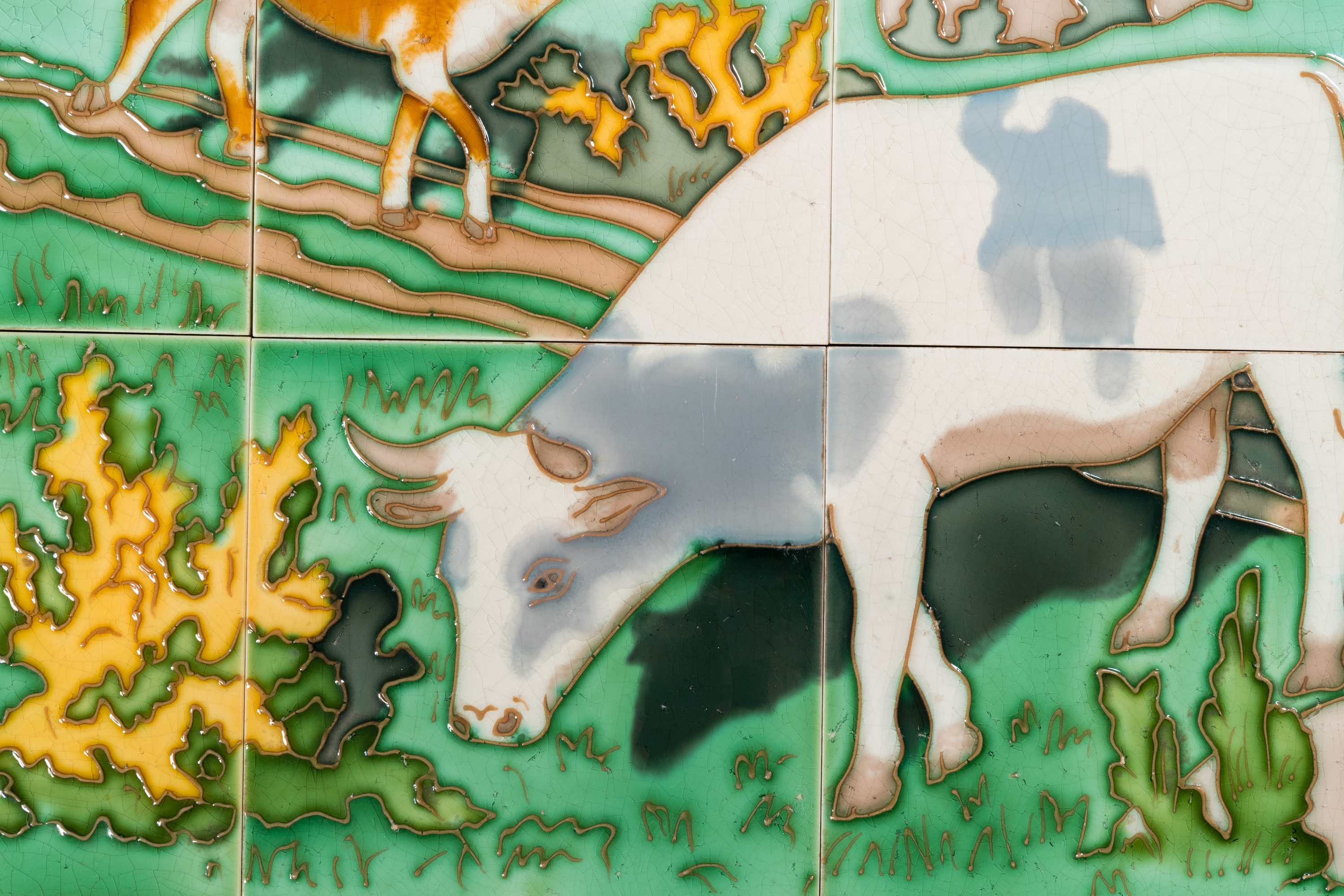 An Art Nouveau tile mural with a shepherdess and her cows in a meadow, Gilliot & Cie., Hemiksem - Image 3 of 4