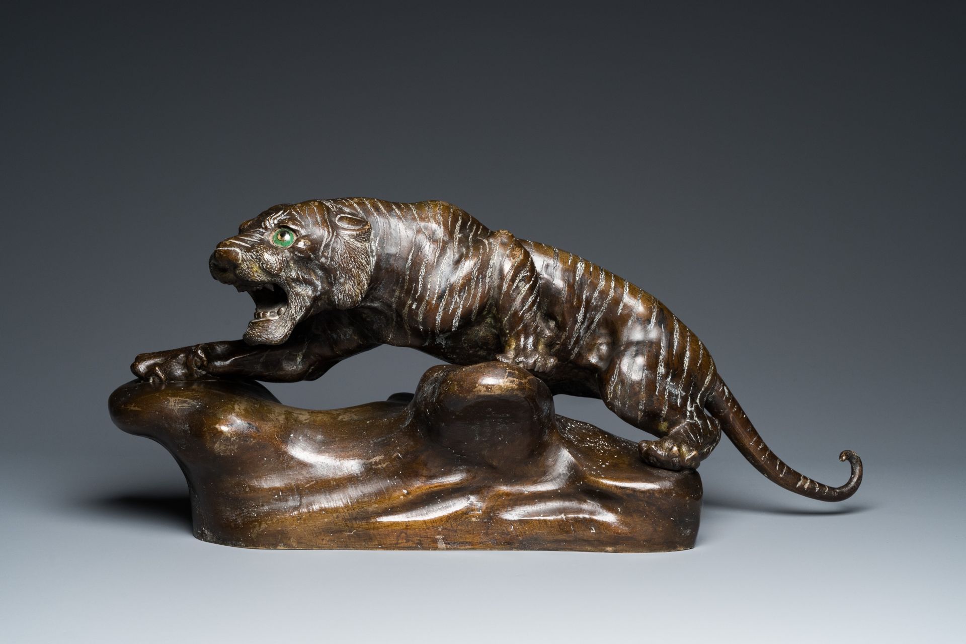 A large Vietnamese bronze tiger on a carved wooden stand, 19/20th C. - Image 3 of 10