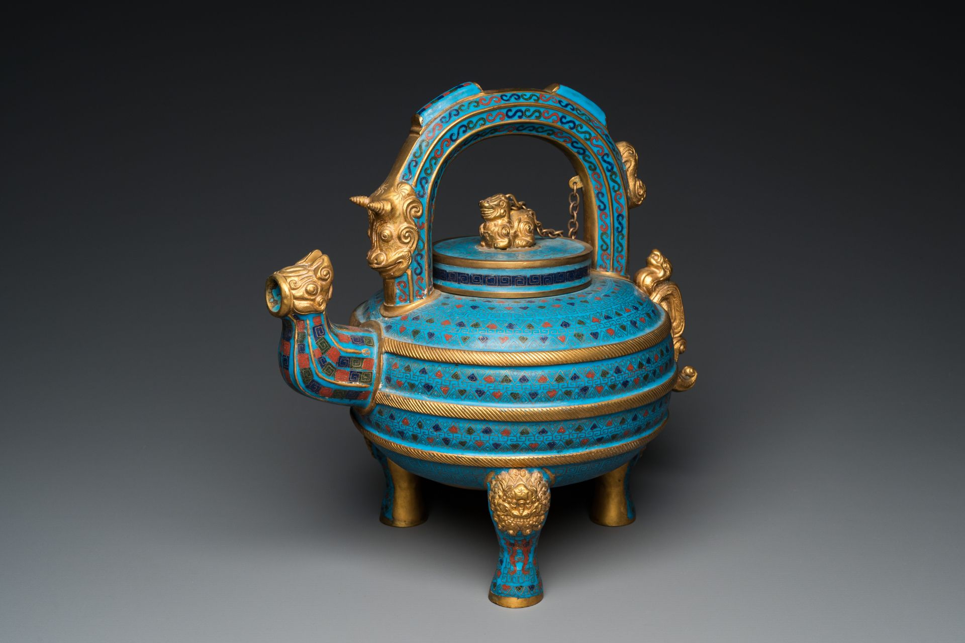 A large Chinese cloisonnŽ tripod wine ewer and cover, 19/20th C.