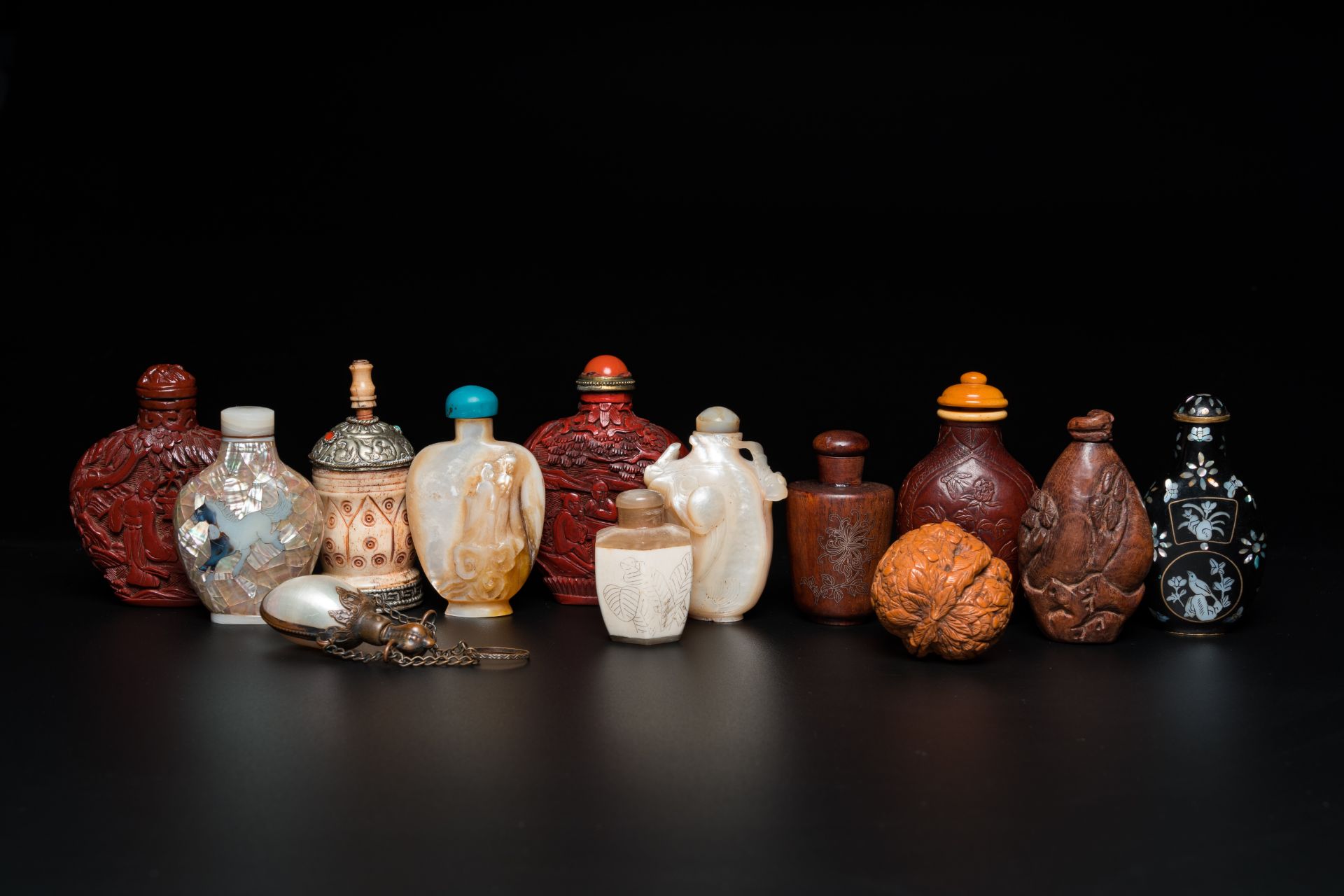 Thirteen Chinese wood, lacquer, mother-of-pearl and bone snuff bottles, 19/20th C.