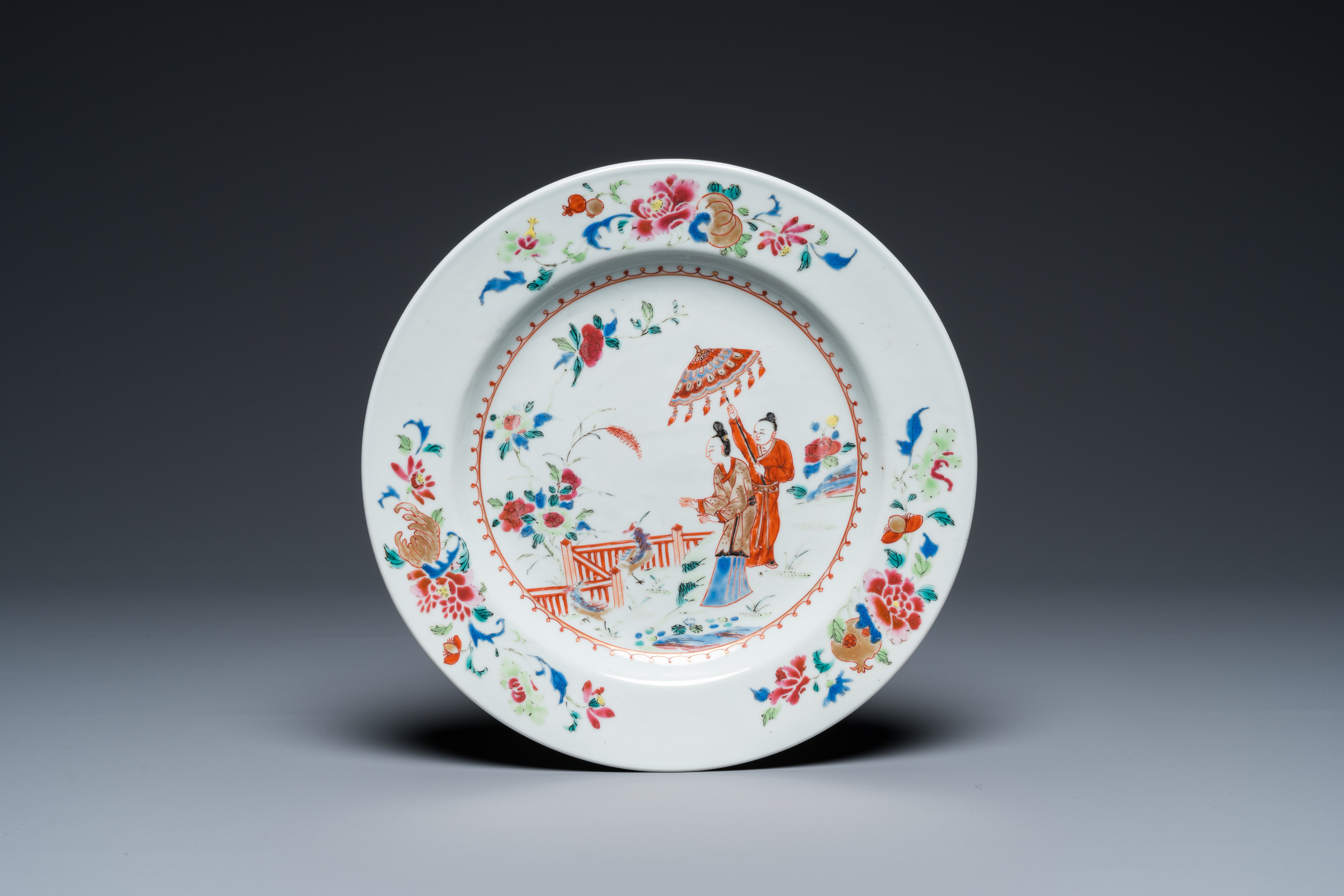 A Chinese famille rose plate with 'Parasol ladies' after Cornelis Pronk, Qianlong