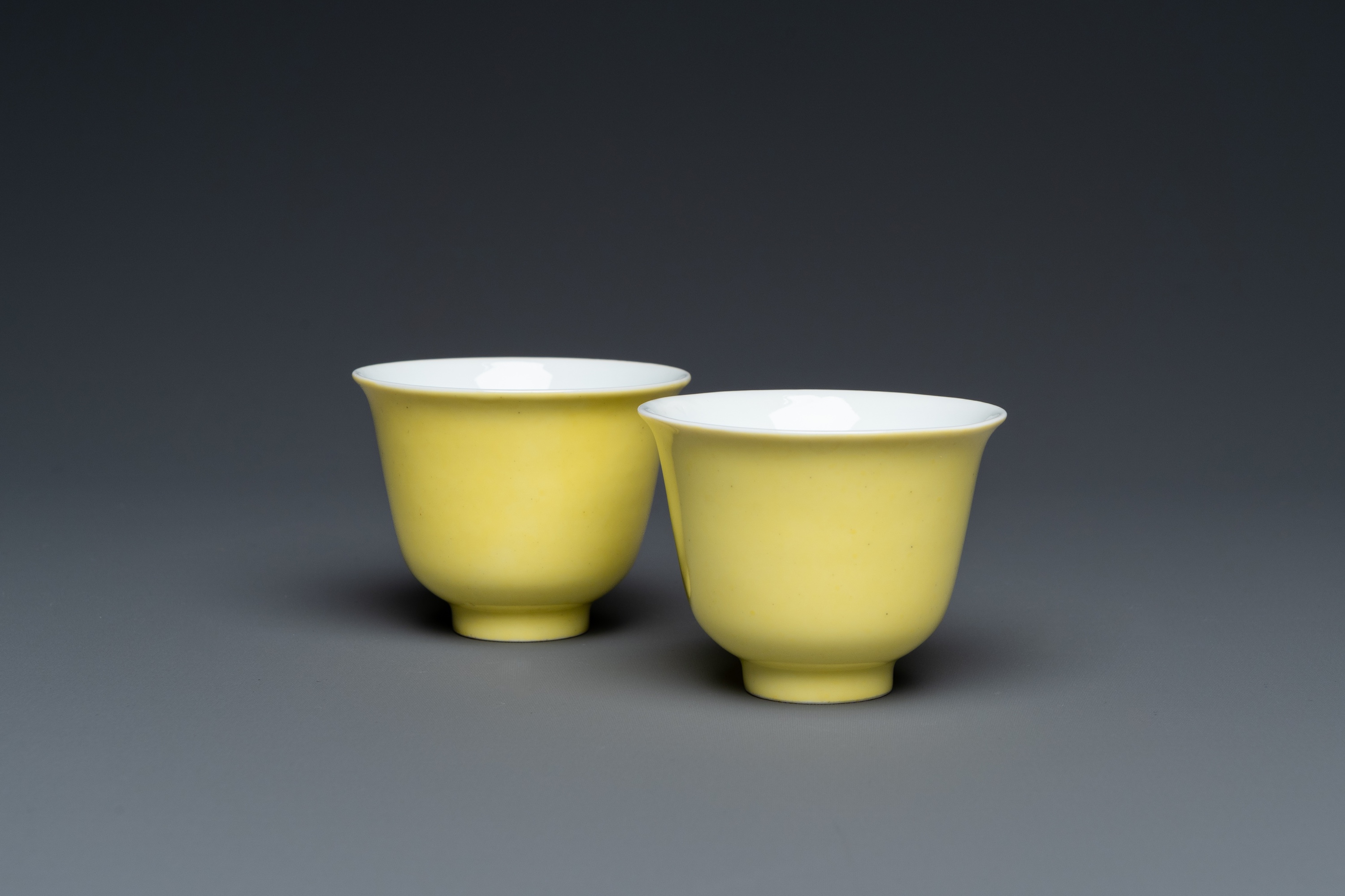 A pair of Chinese yellow-glazed wine cups, Guangxu mark, 20th C.