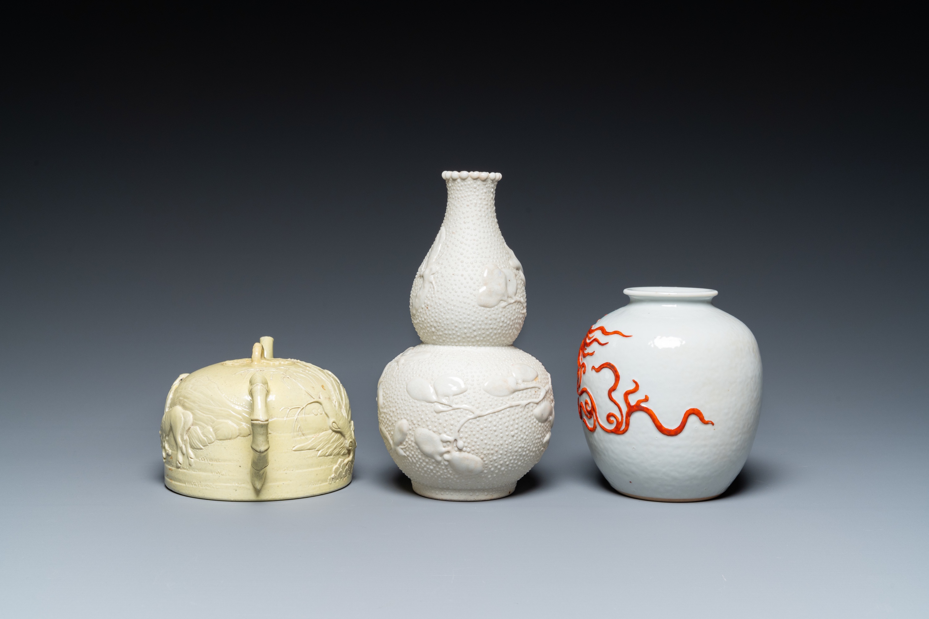 A Chinese yellow-glazed biscuit teapot, a white-glazed biscuit double gourd vase and an iron-red 'ph - Image 5 of 7