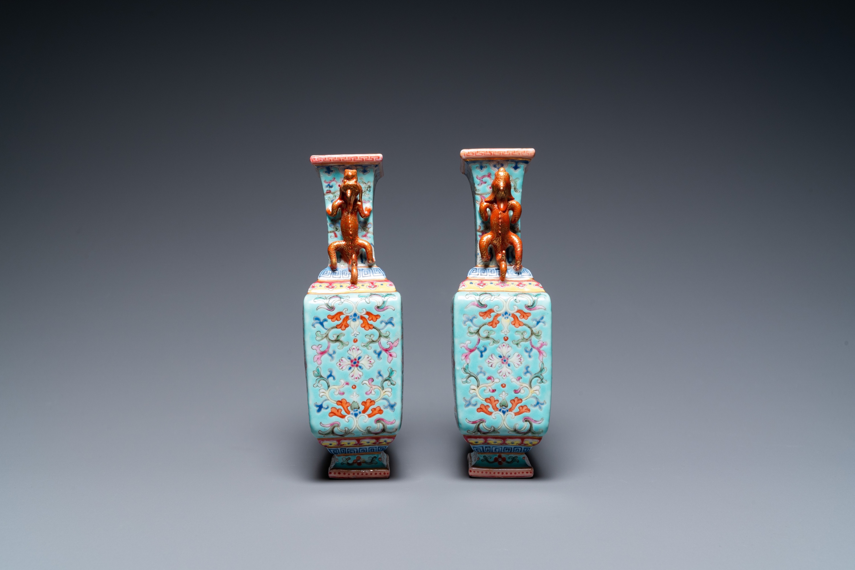 A pair of Chinese famille rose turquoise-ground vases, Qianlong mark, 19/20th C. - Image 4 of 6