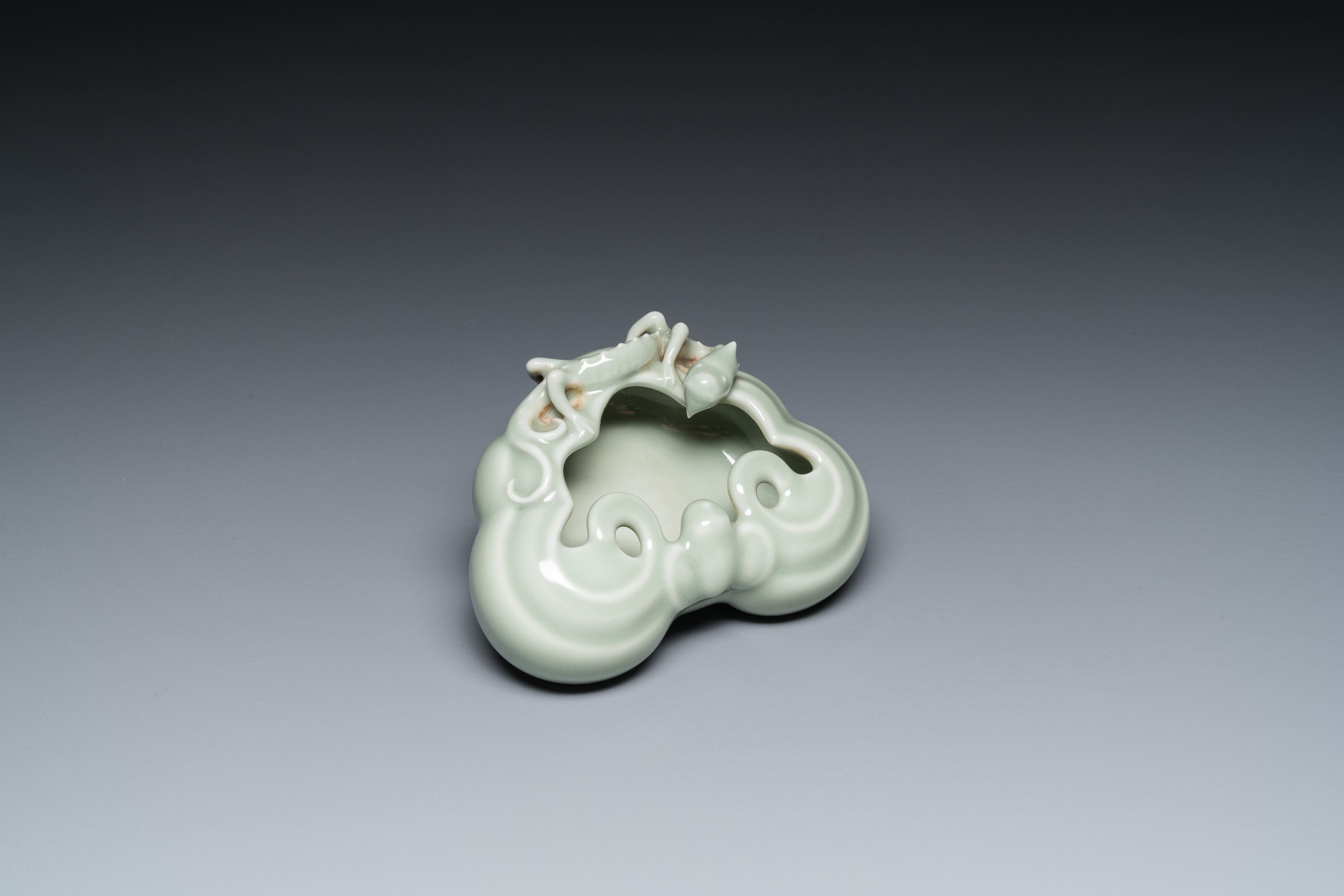 A Chinese celadon-glazed 'lingzhi' brush washer, Qianlong mark, 19/20th C.