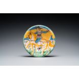 A polychrome Italian maiolica dish with a horserider, Montelupo, 17th C.