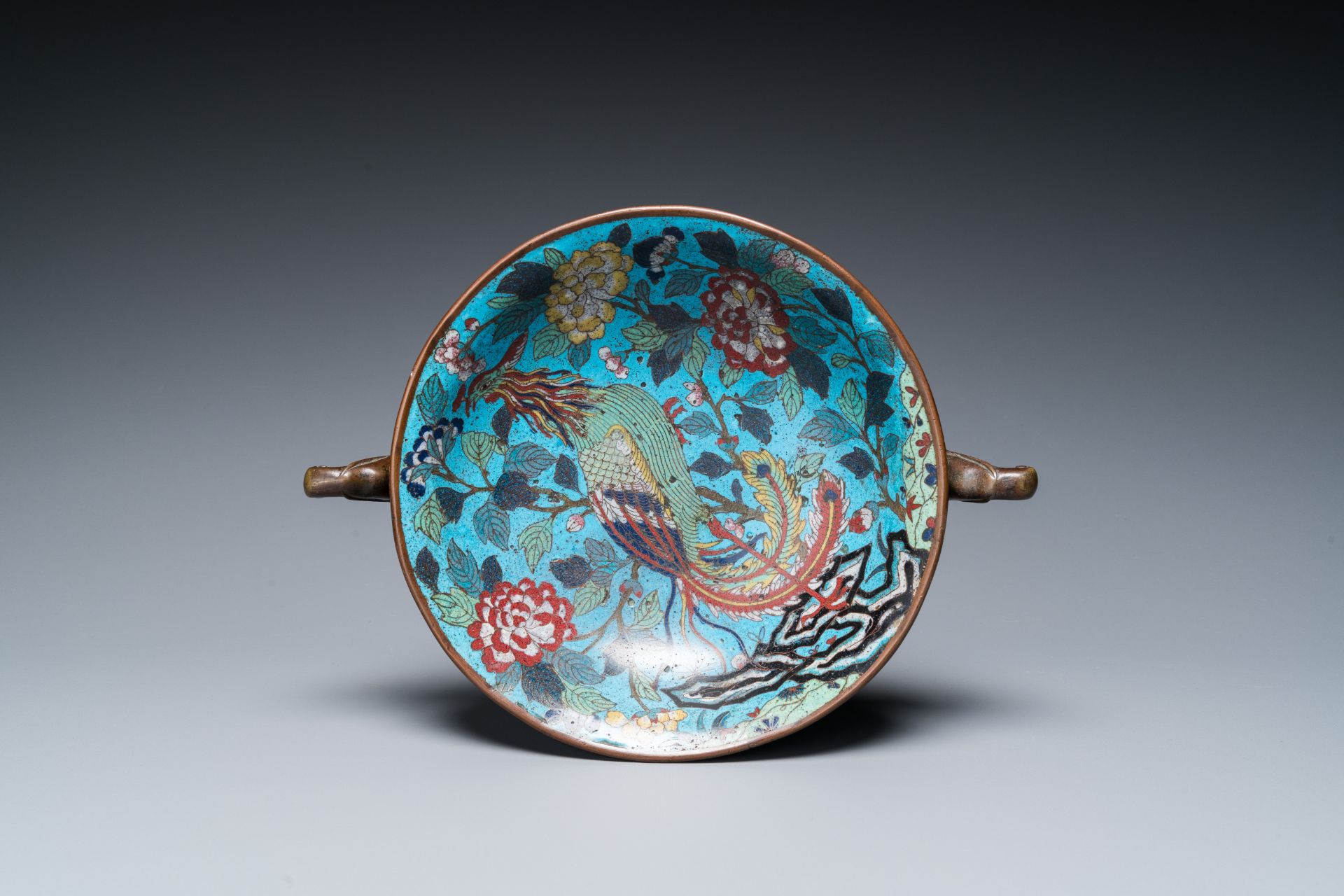 A Chinese cloisonnŽ tripod 'phoenix' bowl with elephant head handles, Qianlong/Jiaqing