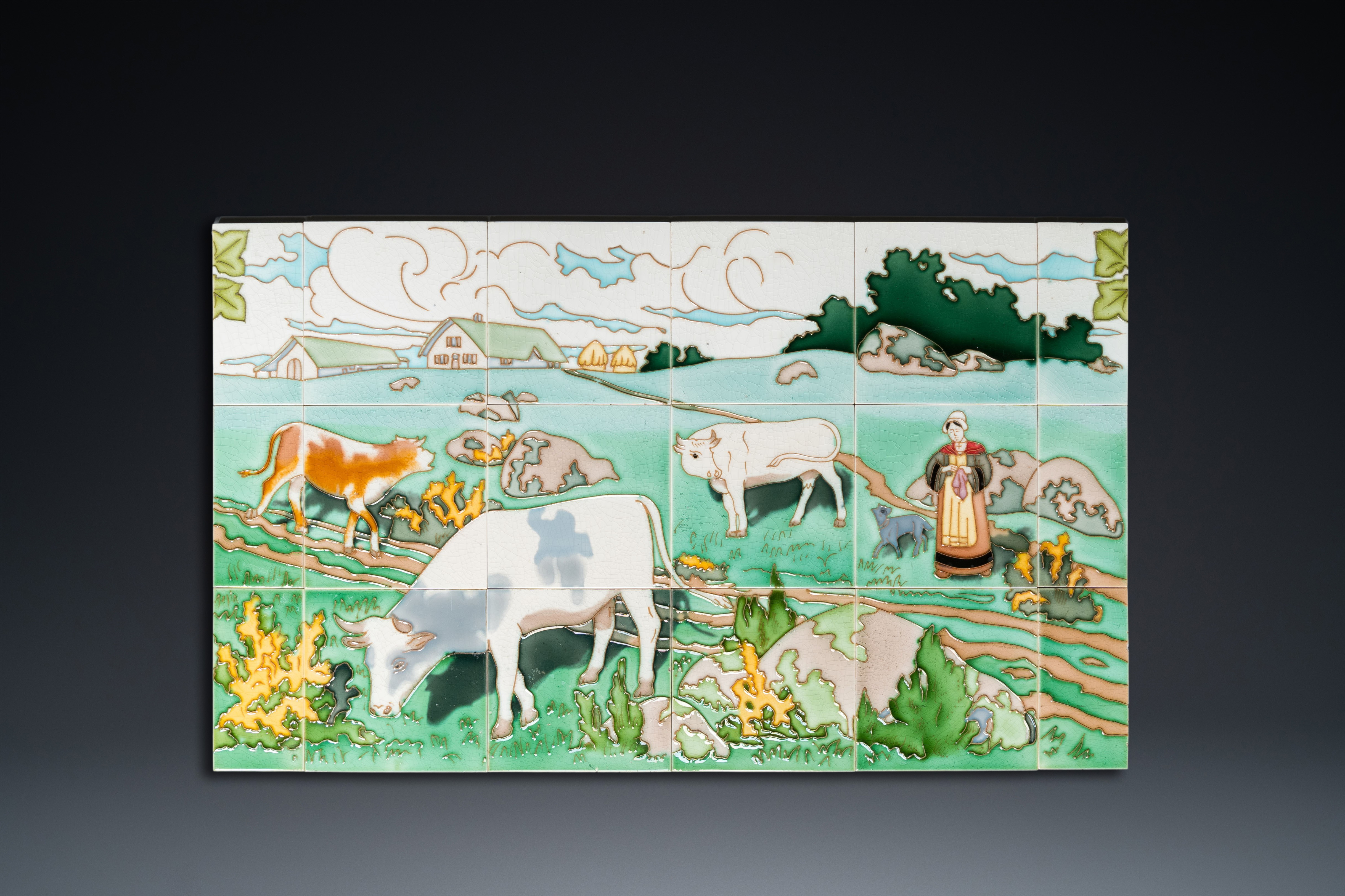 An Art Nouveau tile mural with a shepherdess and her cows in a meadow, Gilliot & Cie., Hemiksem