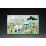 An Art Nouveau tile mural with a shepherdess and her cows in a meadow, Gilliot & Cie., Hemiksem