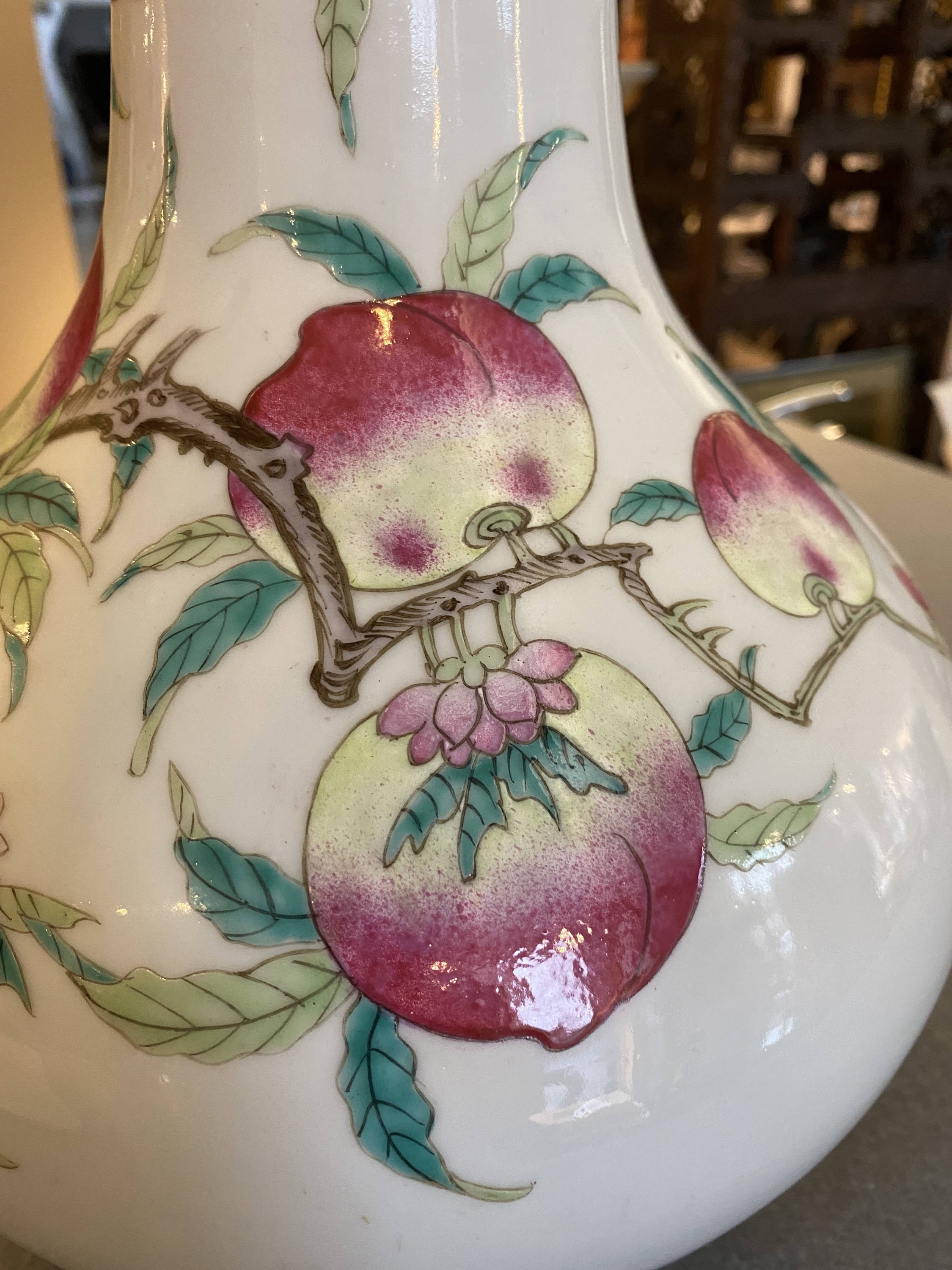 A Chinese famille rose 'nine peaches' bottle vase, 19th C. - Image 12 of 18